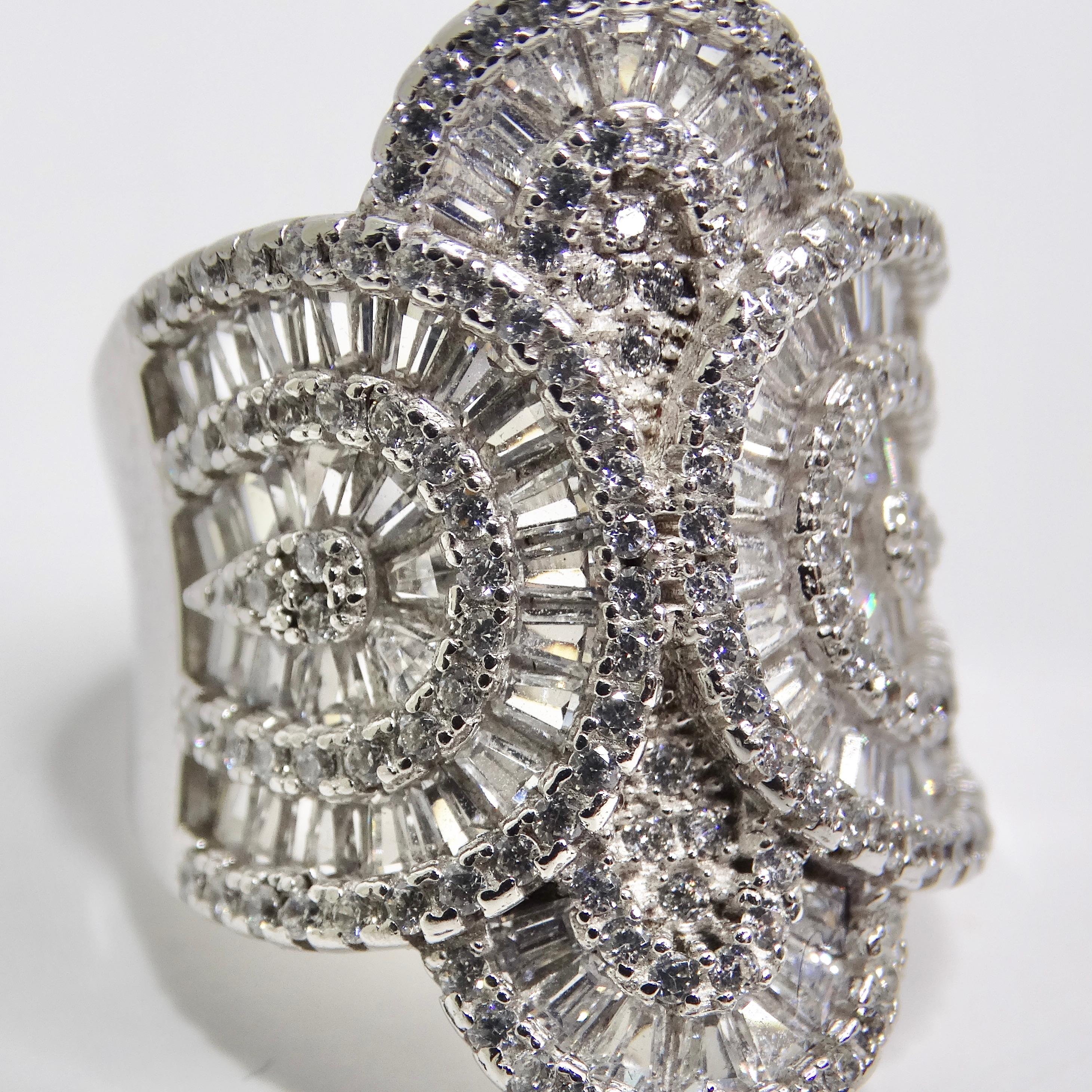 Elevate your style with our 1980s Swarovski Crystal Silver Cocktail Ring, a glamorous and dramatic piece that celebrates the beauty and sparkle of Swarovski crystals. This eye-catching ring is a true masterpiece, crafted from 925 sterling silver and
