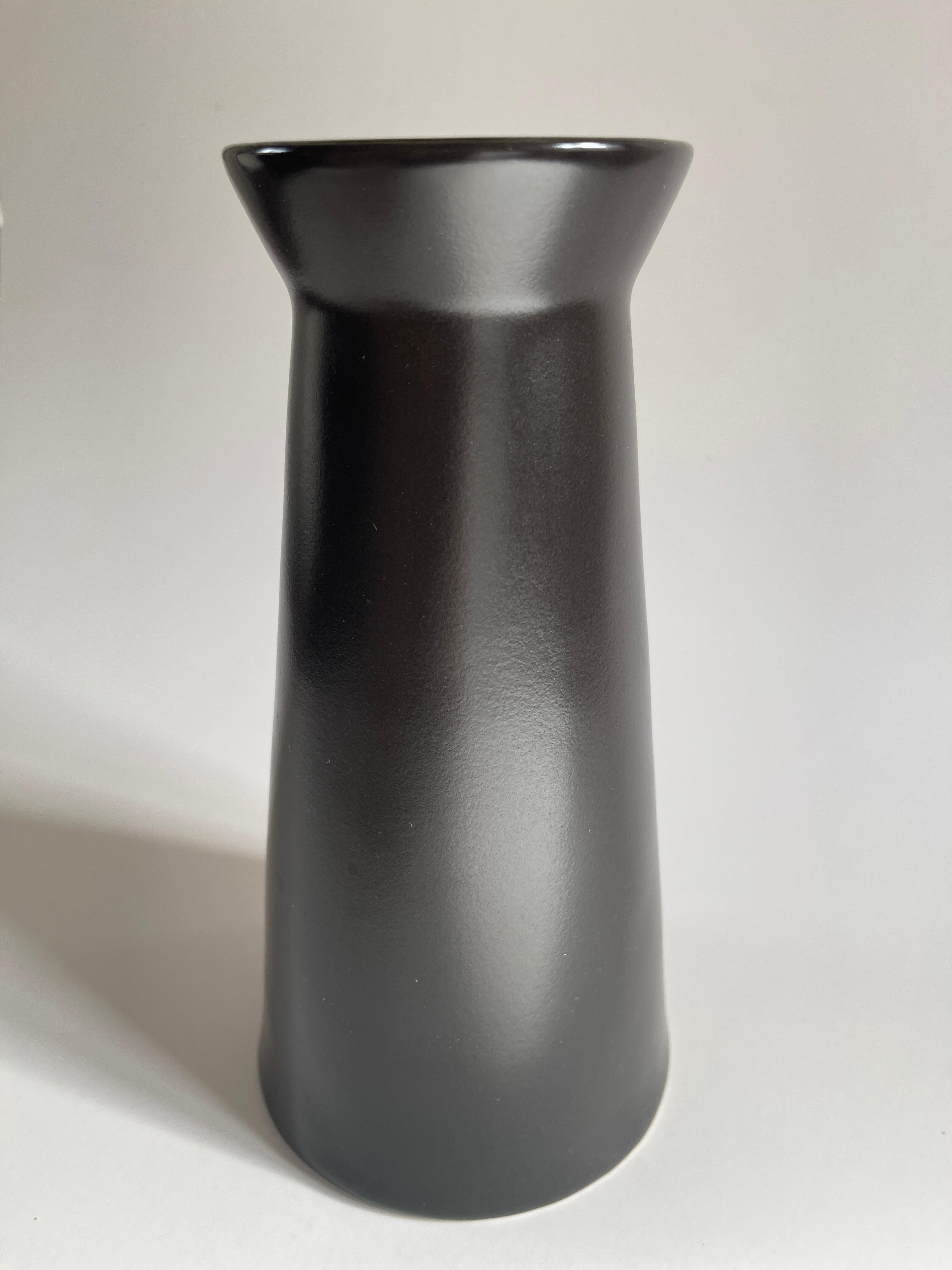 Pair of Swedish modern black matte glaze stoneware vases with Japanese inspired open mouth form. Sweden, c. 1990's.