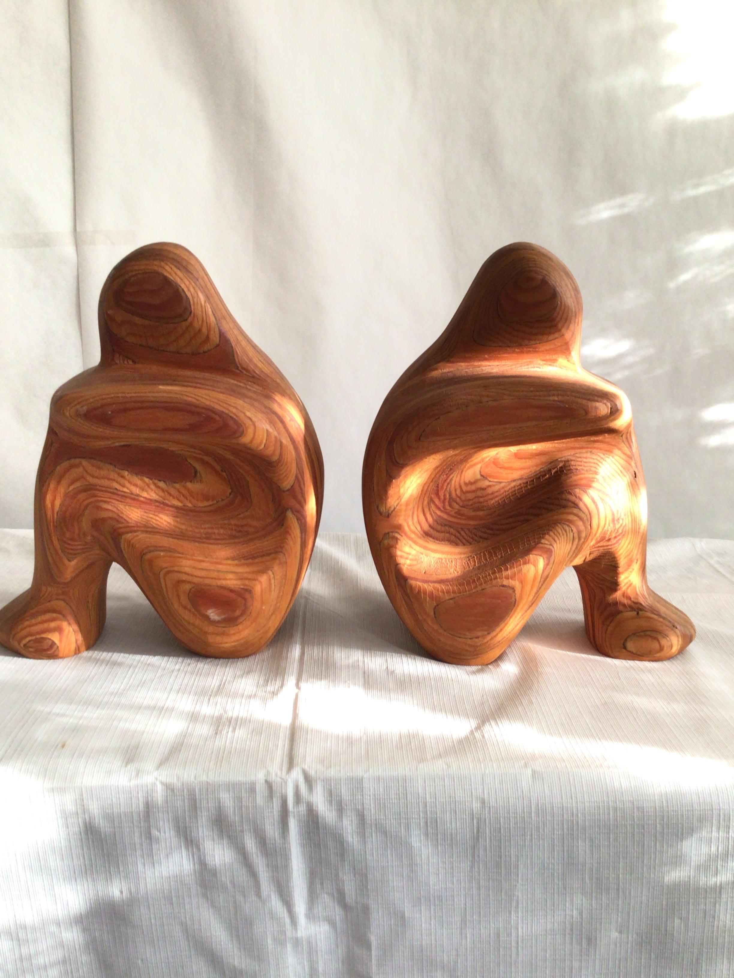 Pair of 1980s swirled wood sculptural bookends is signed: Largrave. 
The golden color wood grain adds depth and character to these functional objects.