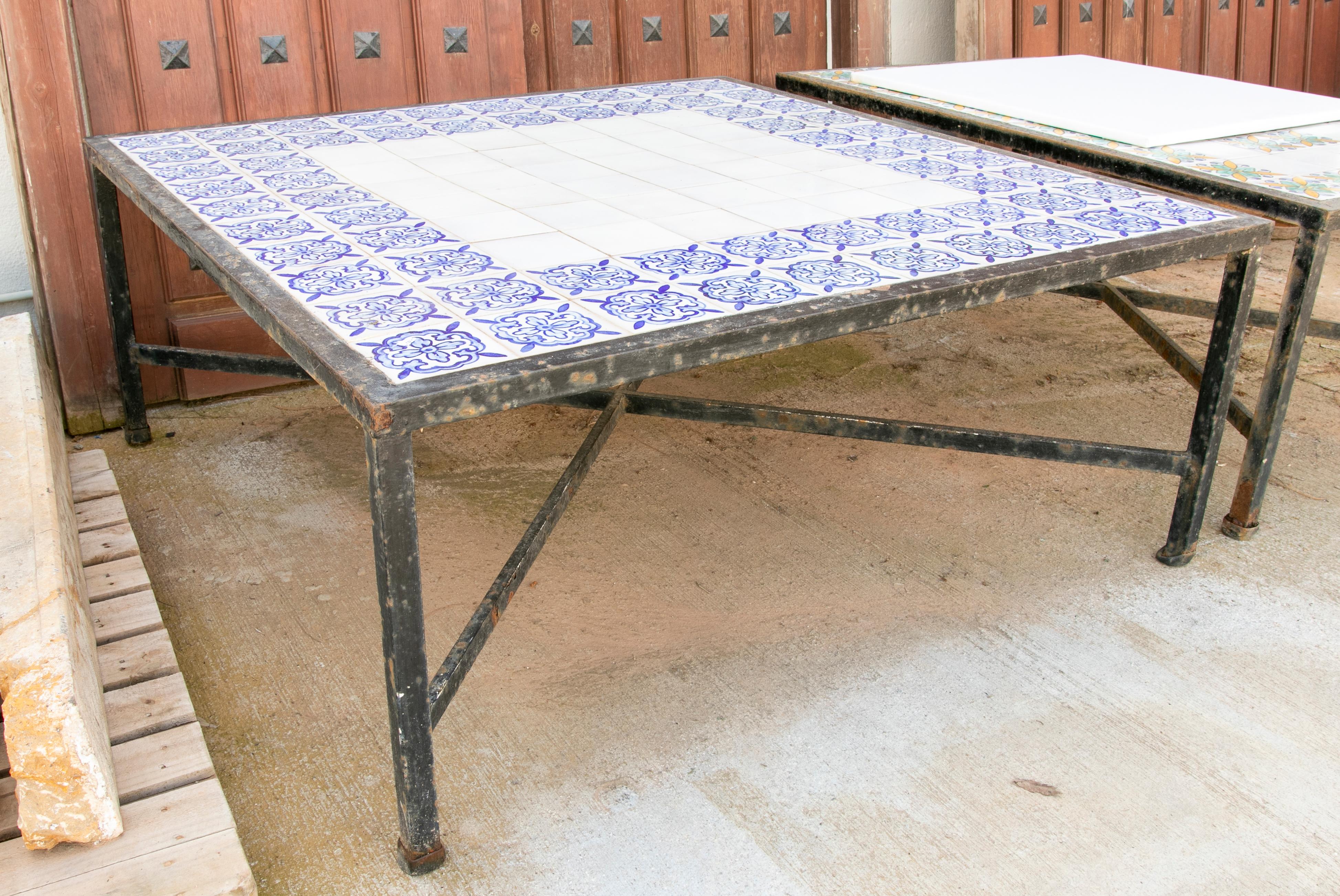 1980s Table with iron base and geometrical tiles on top.