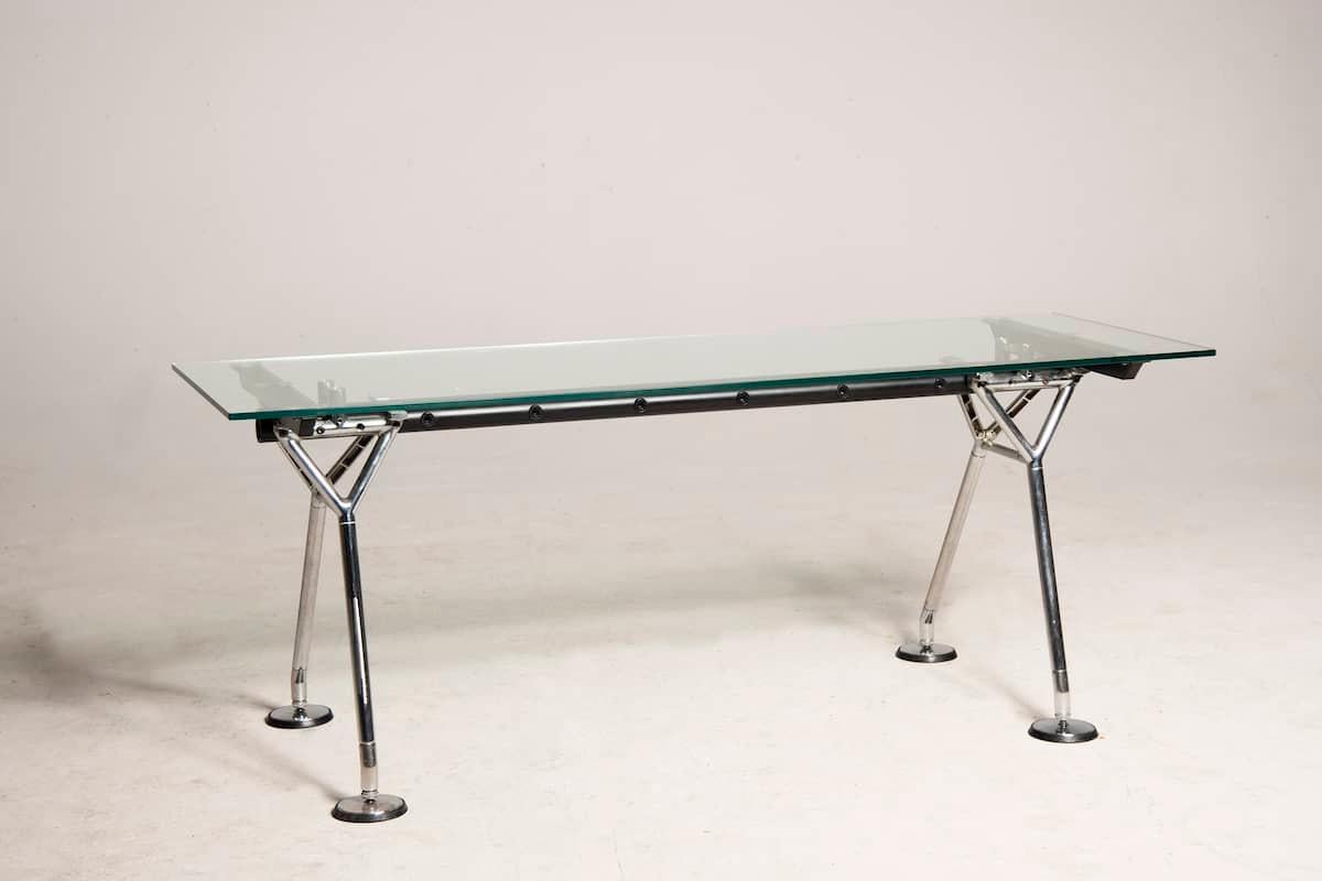 Table produced in the 1980s by Tecno on design by Norman Foster. Chromed steel metal structure. Rectangular glass top recently added . Feet are adjustable. This table is suitable both as dining table and as office table as well. 
Excellent general