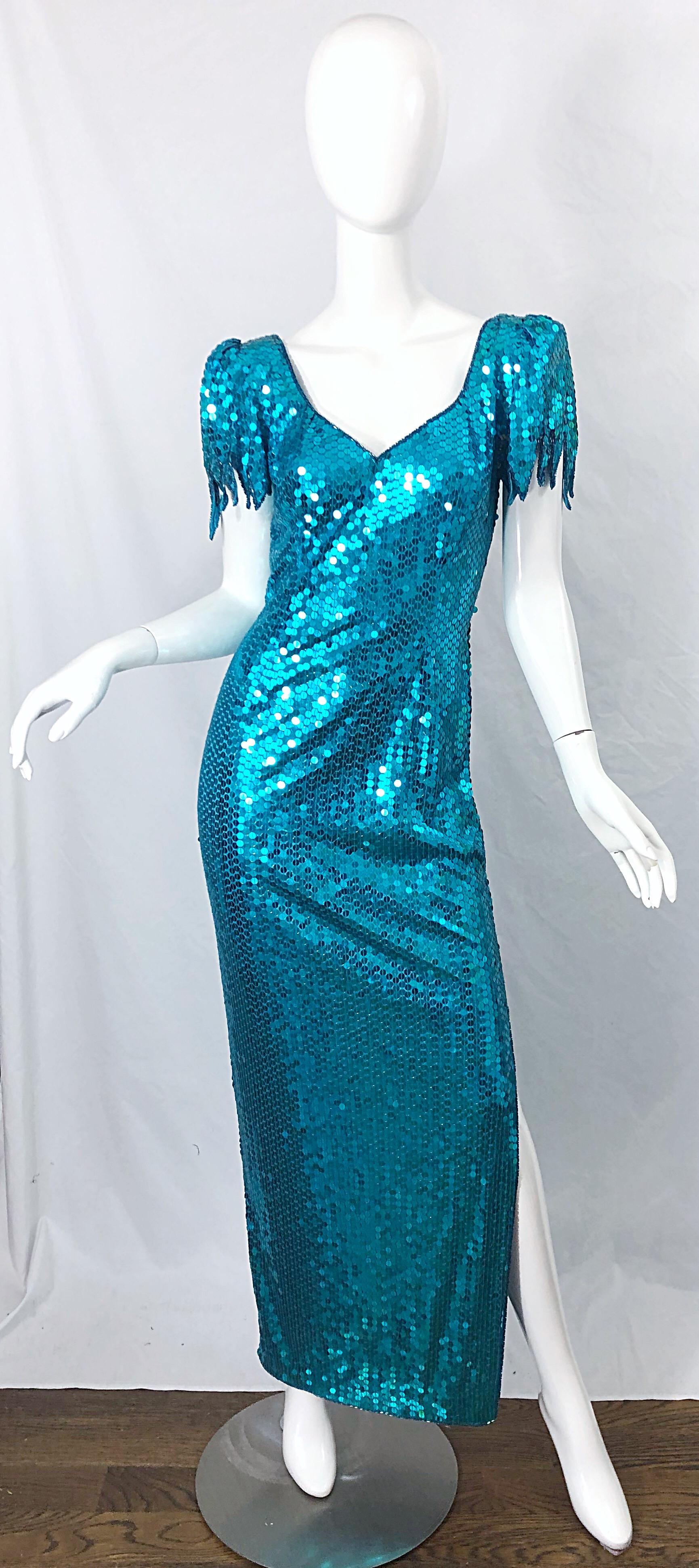 Avant Garde TED LAPIDUS turquoise blue fully sequined evening gown dress ! Features thousands of hand-sewn sequins throughout the entire dress. Hundreds of seed beads align the collar. Scalloped sleeve cuffs. Slit up the left side of the leg reveals