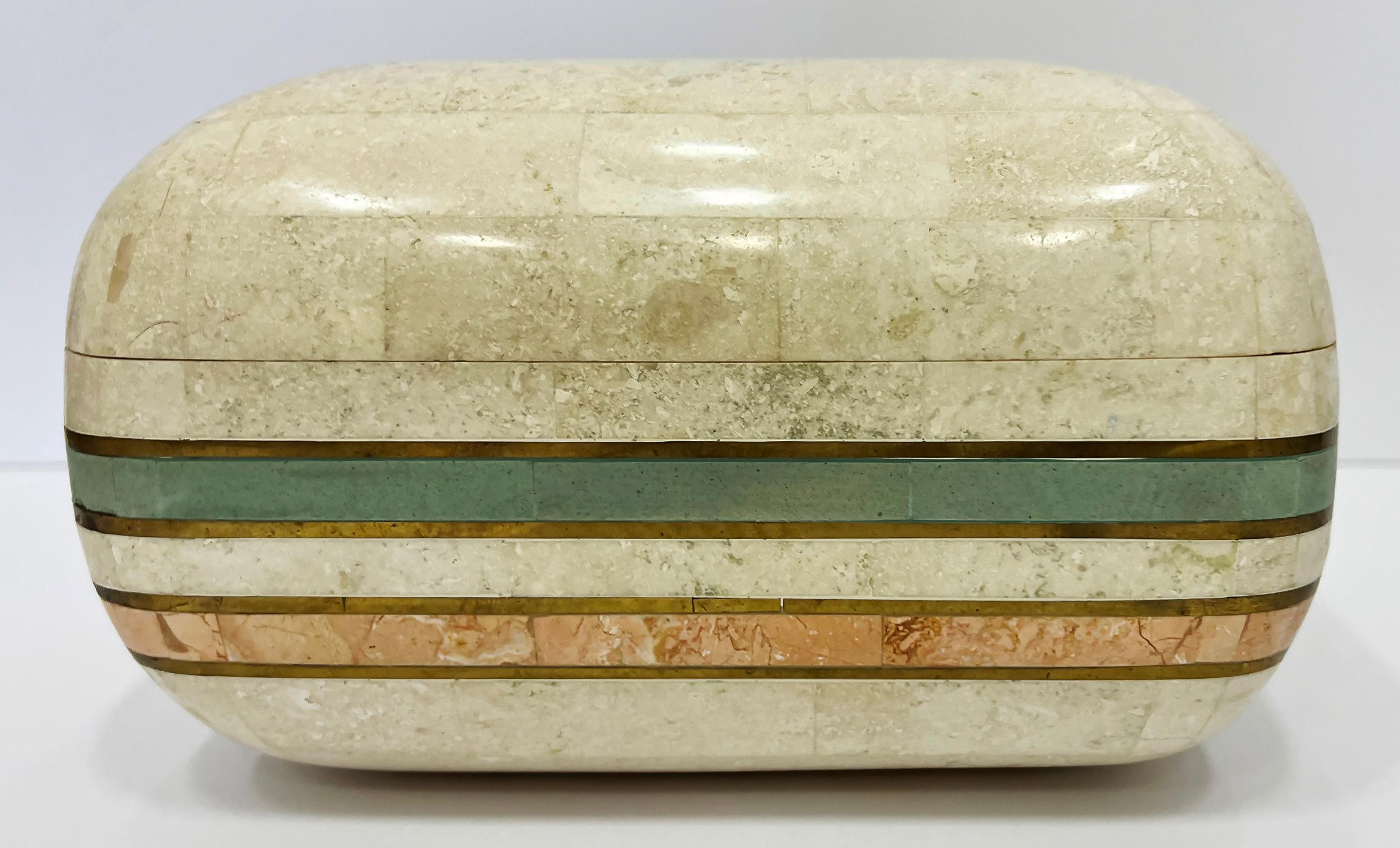 1980s Tessellated Stone Box with Brass Trim, Maitland Smith Attributed

Offered for sale is a 1980s lidded tessellated stone decorative box with accent color stone and inset brass trim. The box has rounded corners and the lid hinges for access. The