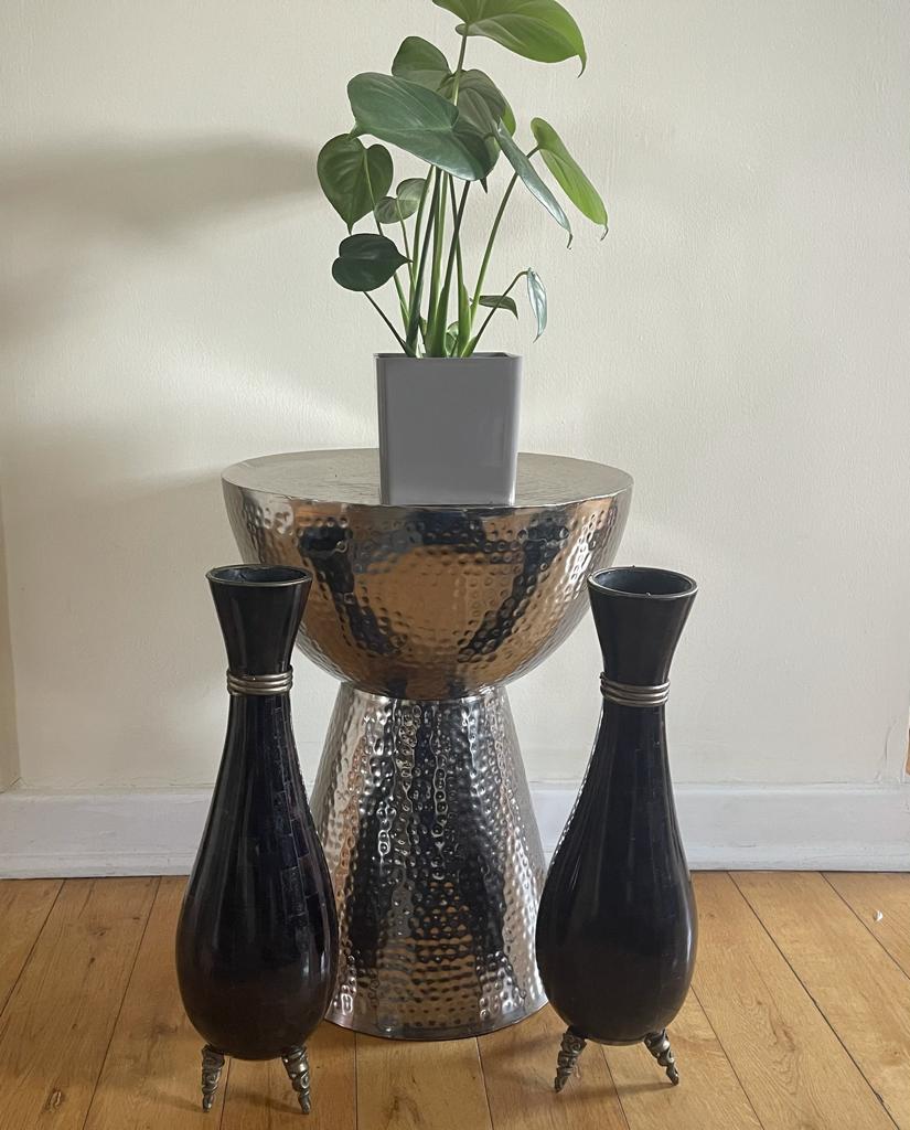 20th-century vintage pair of ornamented tessellated stone vases by Maitland -Smith handcrafted in the Philippines. These exceptional decorative pieces stand on silverplated tripod feet and the neck of the vases are highlighted by silver metal banded