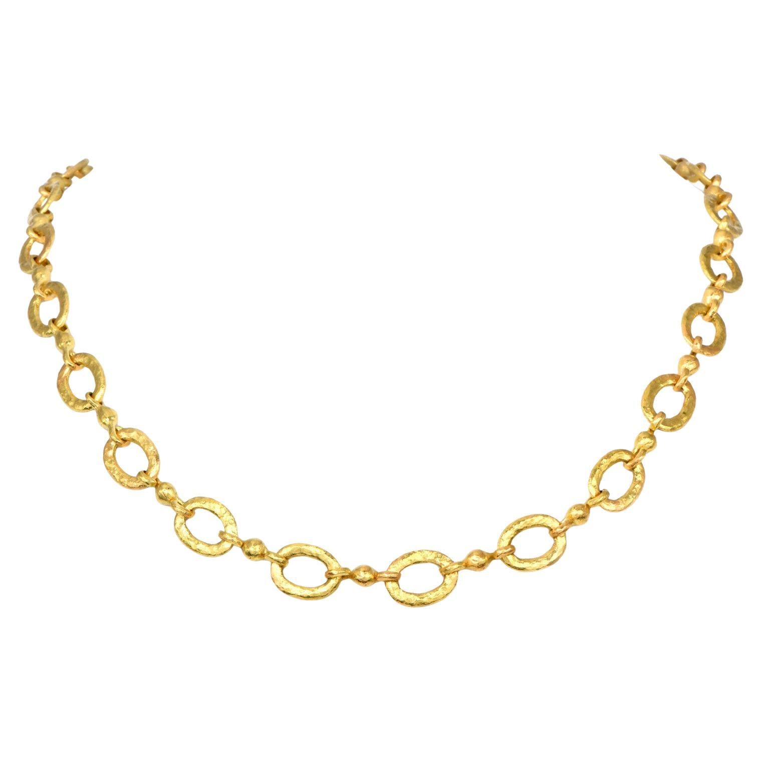 1980s  Collier à maillons ovales texturés avec chaîne à bascule en or 18K