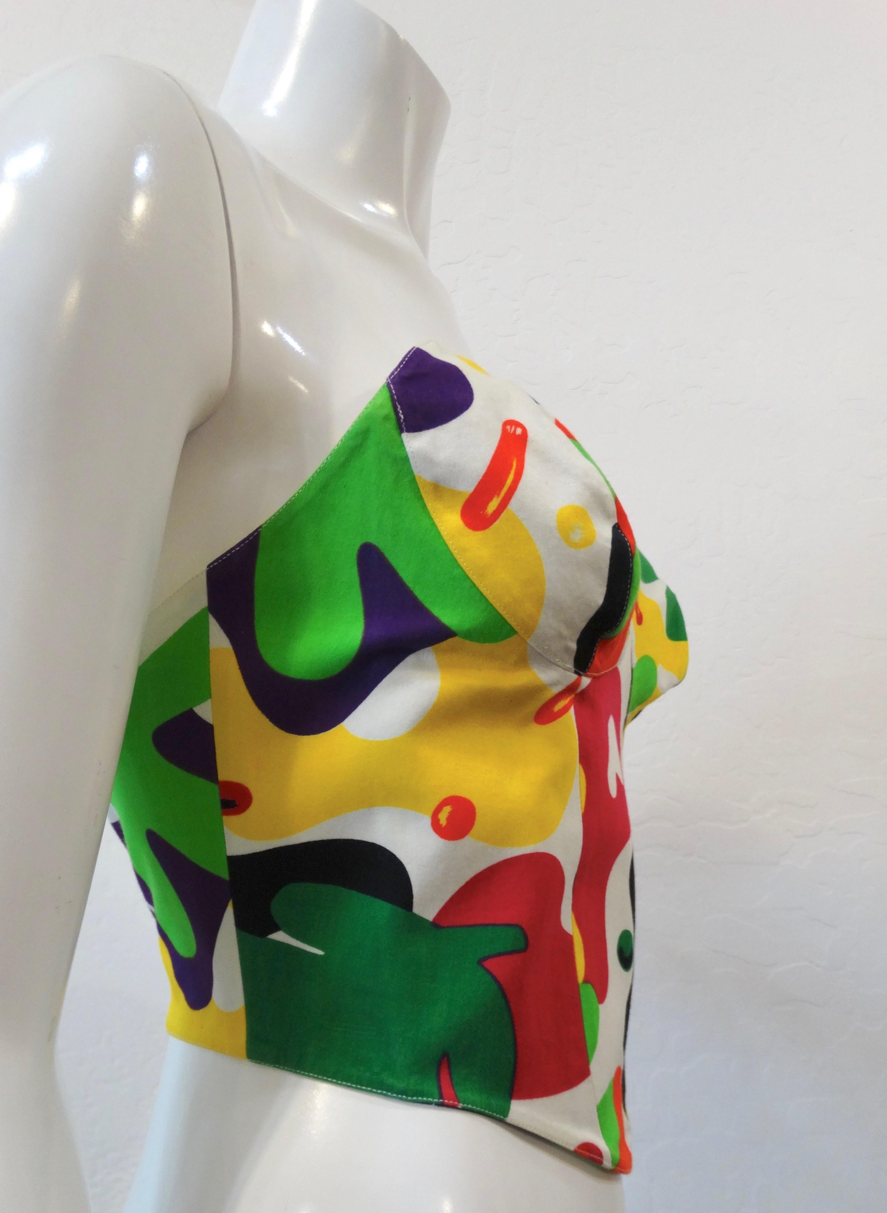 Score yourself a piece of golden-era 1980s Thierry Mugler with our abstract printed bustier! Ultra-feminine femmebot silhouette with bright bold rainbow pattern. Hook and eye closures up the back. Pairs perfectly with your favorite Mugler suit set