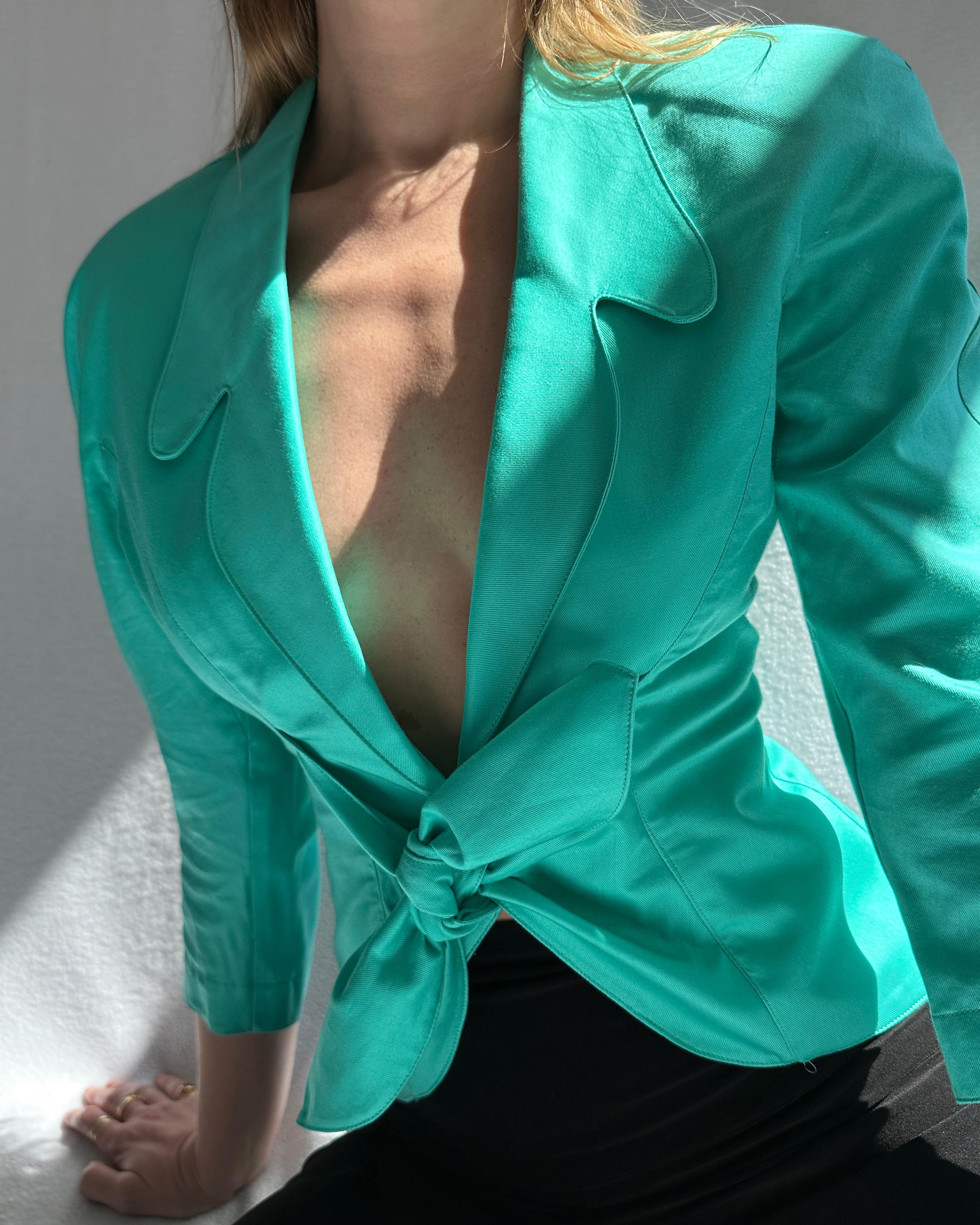 VERY BREEZY presents:  This vintage Thierry Mugler jacket is a serious investment piece, in a shape that's classic Mugler yet very rare to find. Circa late 1980s, the exaggerated nipped waist, dramatic lapels, and mermaid-green hue are signatures of