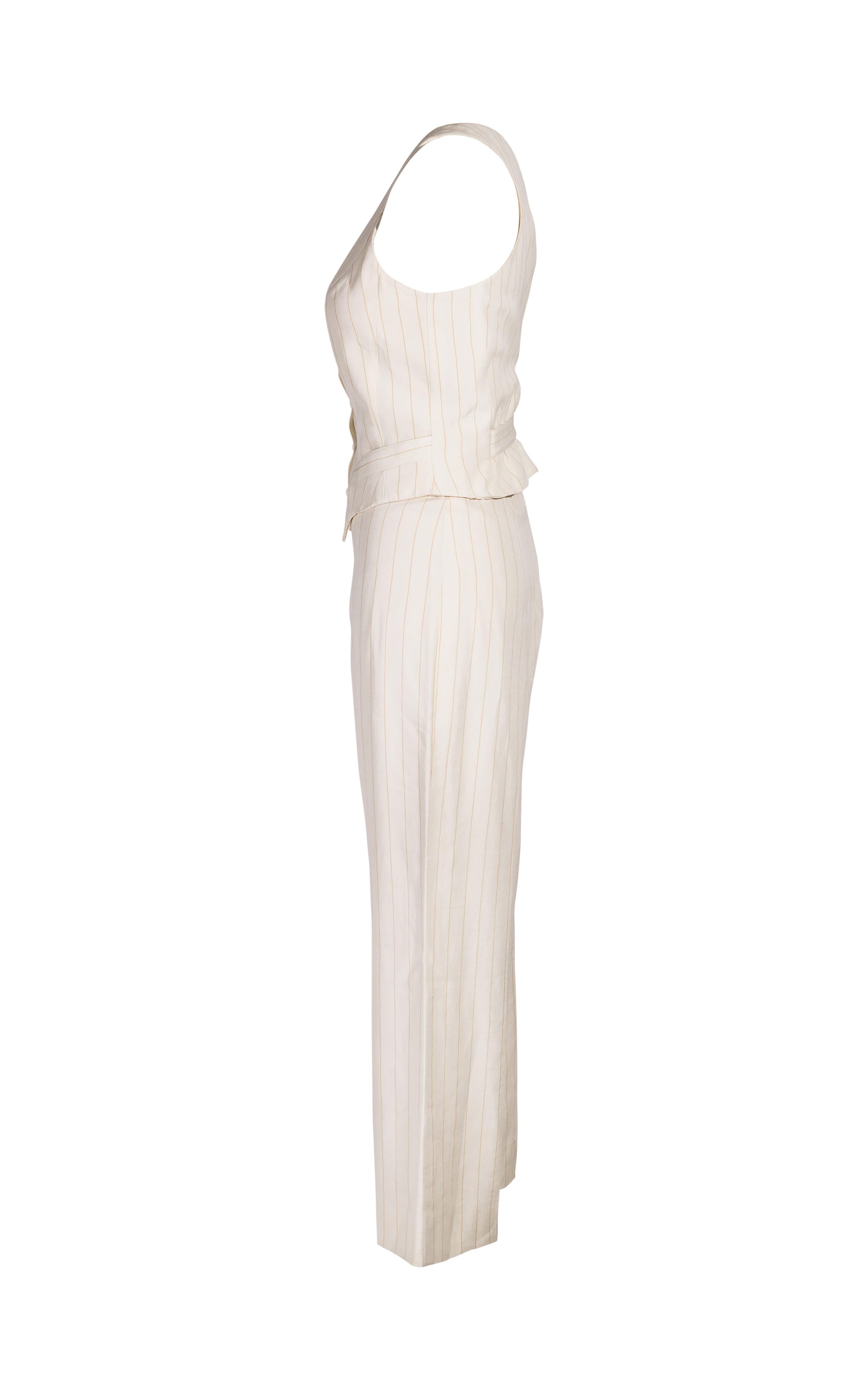 1980's Thierry Mugler off-white striped pantsuit. Fitted sleeveless button-up vest and high-rise wide-leg pant set with yellow stripes throughout. Circular fabric buttons and small flap pockets on vest and fitted waist.

Measurements
Best fits size