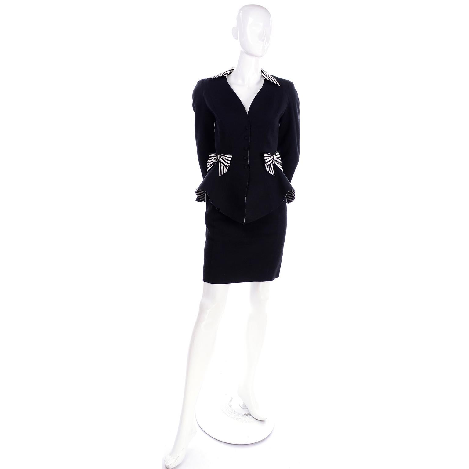 This is a vintage 1980's black cotton pique skirt suit designed by Thierry Mugler.  The peplum style blazer has black and white striped upturned cuffs, collar and bows.  We love that the peplum itself is lined with the same black and white stripe