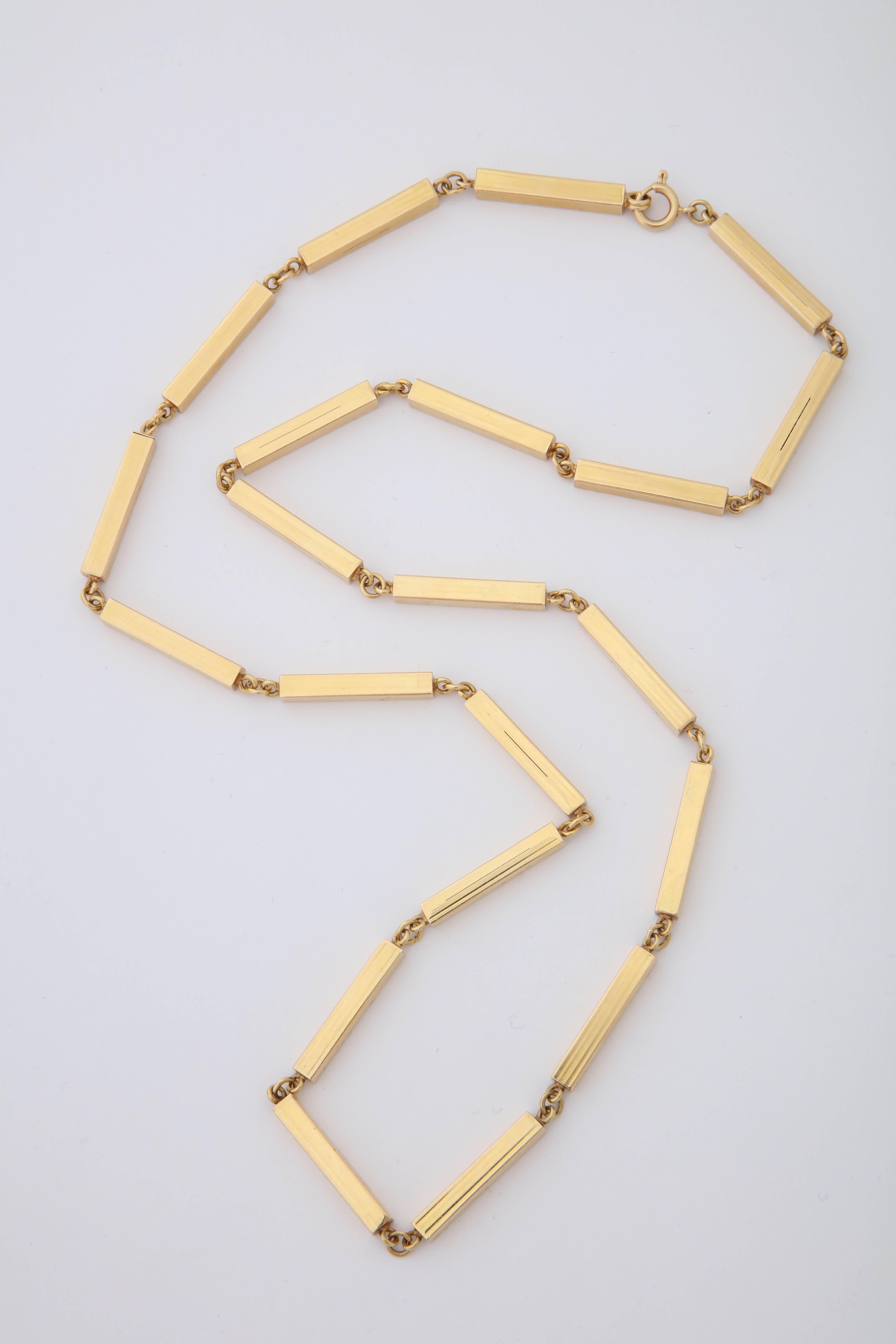 One Unisex Chain Link Necklace Composed Of Twenty One Vertical Three Dimensional Box Links. Each Link Measuring Approximately 1.25 inches long.With Easy Spring And Jump Ring Closure Designed In Italy In The 1980's. Stamped 750 Italy.Gold Work Has
