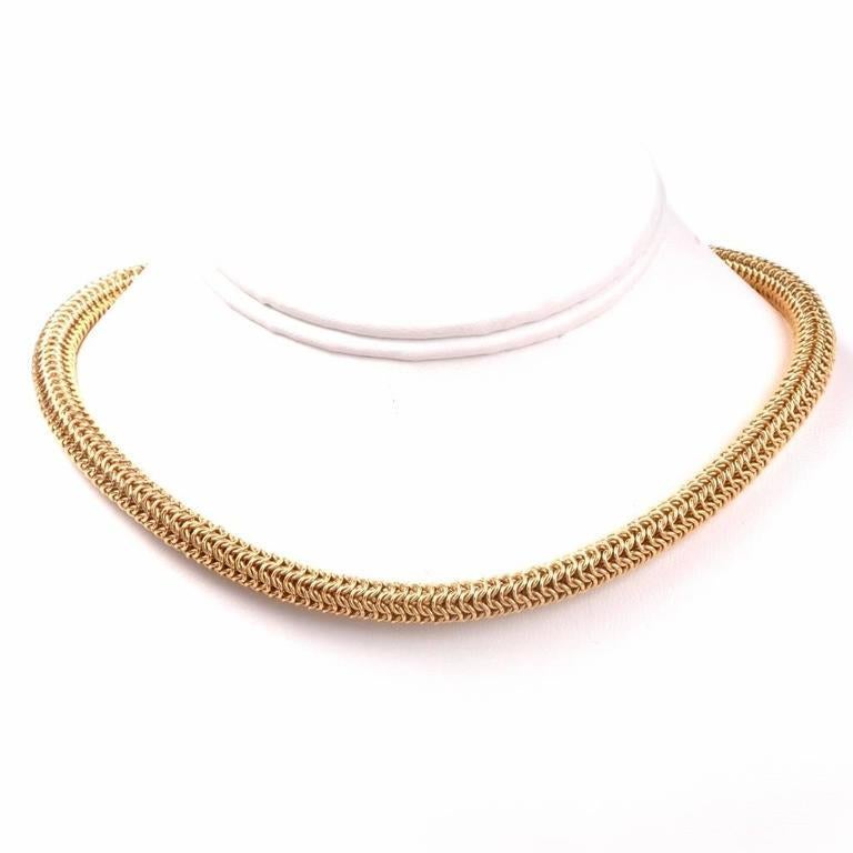 This late 1980's Tiffany & Co. diamond choker necklace and pendant, crafted in solid 18K yellow gold. This ellegant Tiffany Co. gold mesh necklace is accompanied by a detachable Tiffany & Co. diamond sliding enhancer, covered with approx. 97 genuine