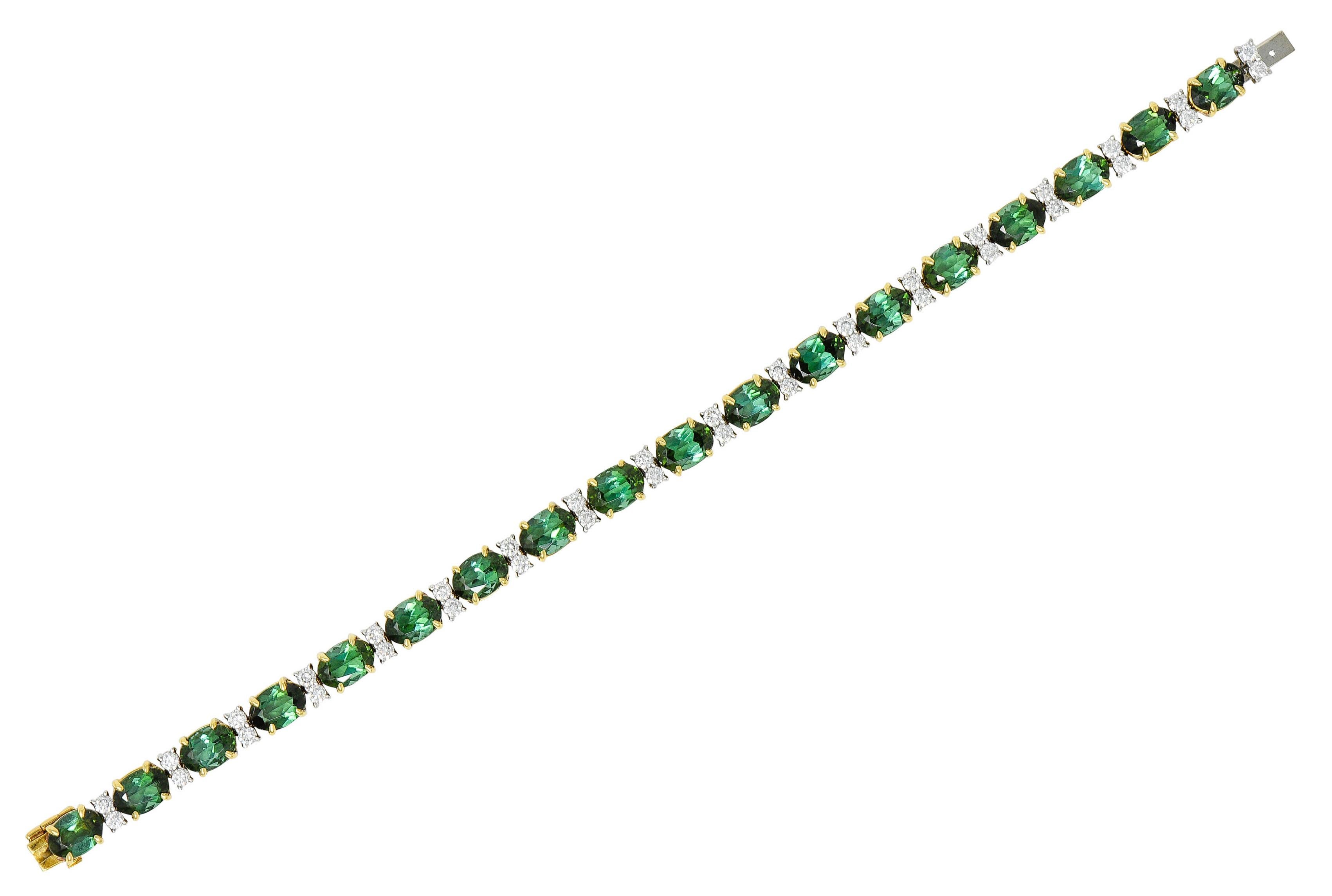 Tennis style bracelet is comprised of green tourmalines alternating with pairs of round brilliant cut diamonds

Tourmalines are oval cut and very well matched in evergreen color

Talon set in yellow gold baskets while measuring approximately 7.0 x