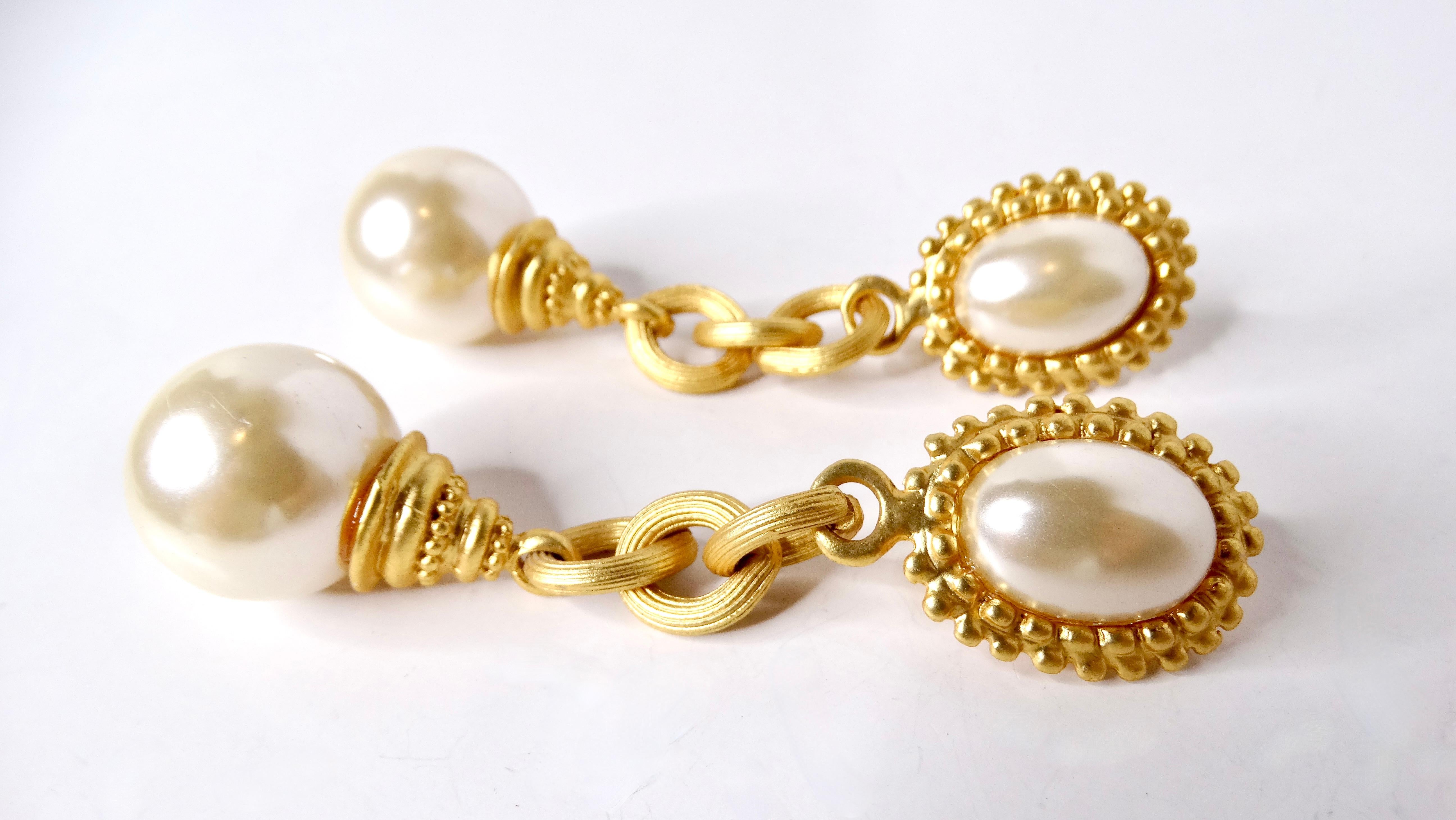 Elevate your style with these exquisite 1980s Tiffany Inspired 18k Gold Plated Costume Pearl Drop Clip-On Earrings. Beautifully crafted, these earrings feature a luminous faux pearl nestled at the top, accompanied by a gracefully suspended faux