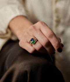 1980s ‘Toi-et-Moi’ Emerald, Sapphire and Diamond 18kt gold ring.