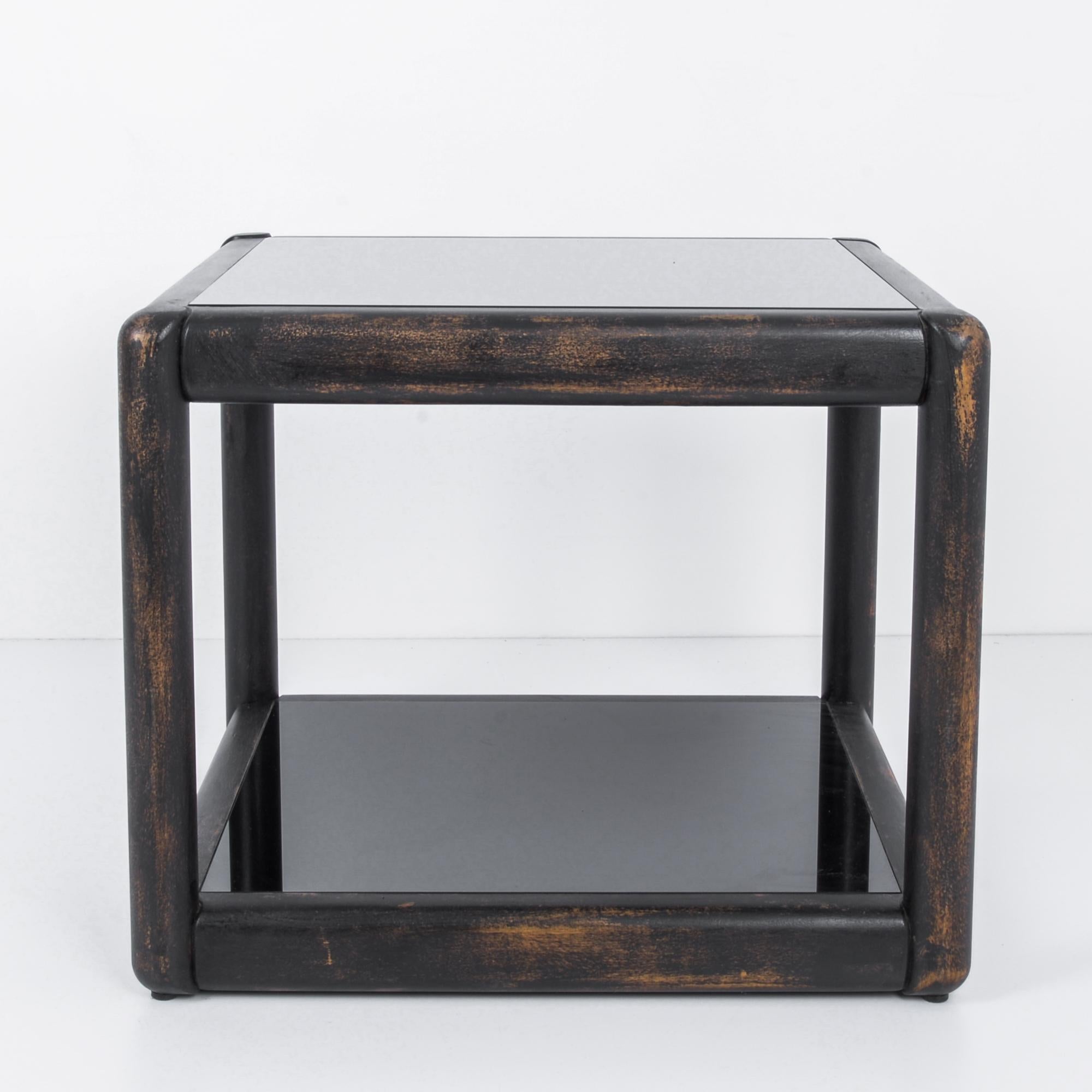 This side table was manufactured by TON, known for their timeless designs and use of high quality wood. It was made in the former Czechoslovakia, circa 1980, and features a geometric construction softened by rounded edges. The wooden frame is