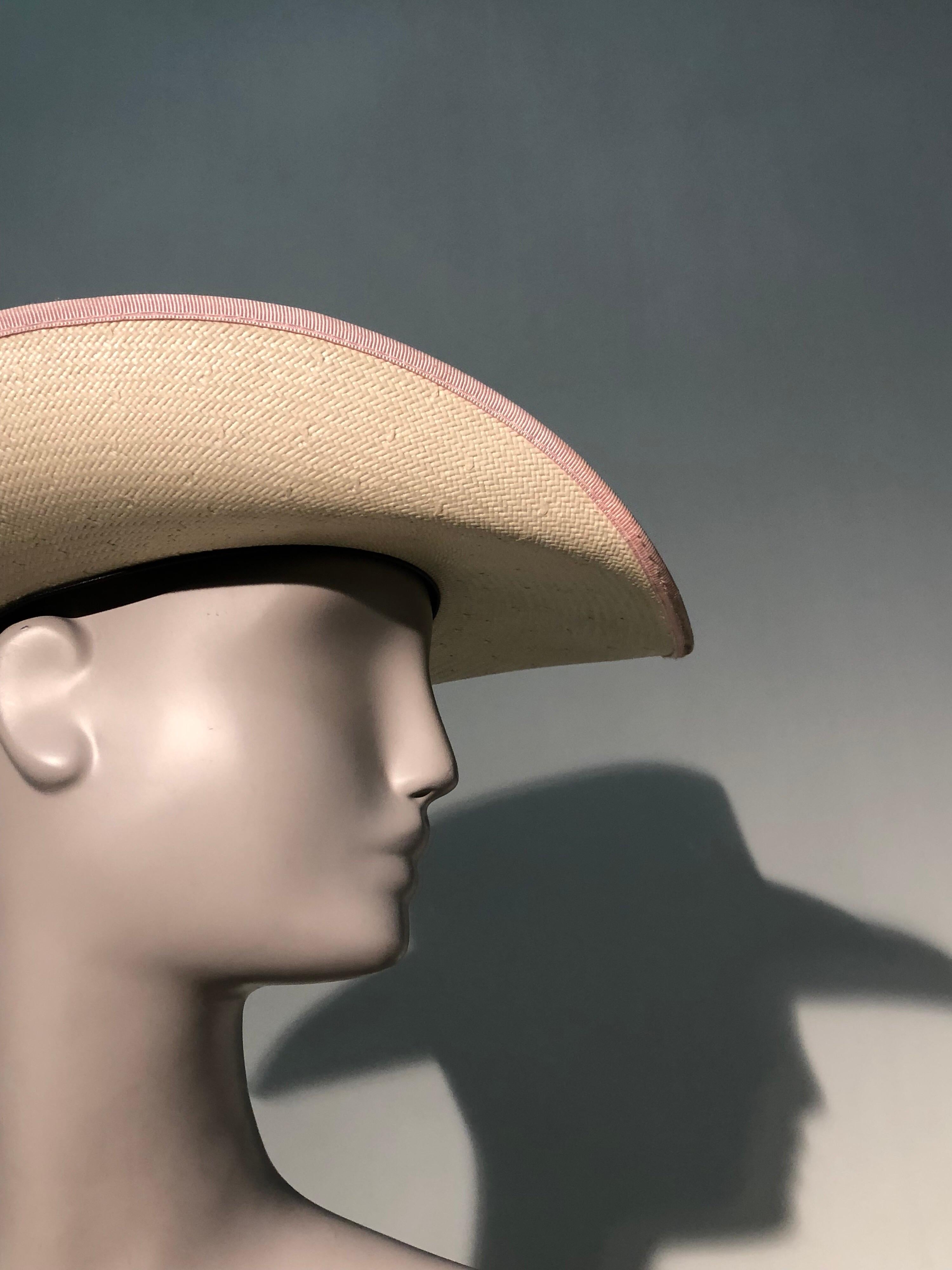 straw hat with pink ribbon