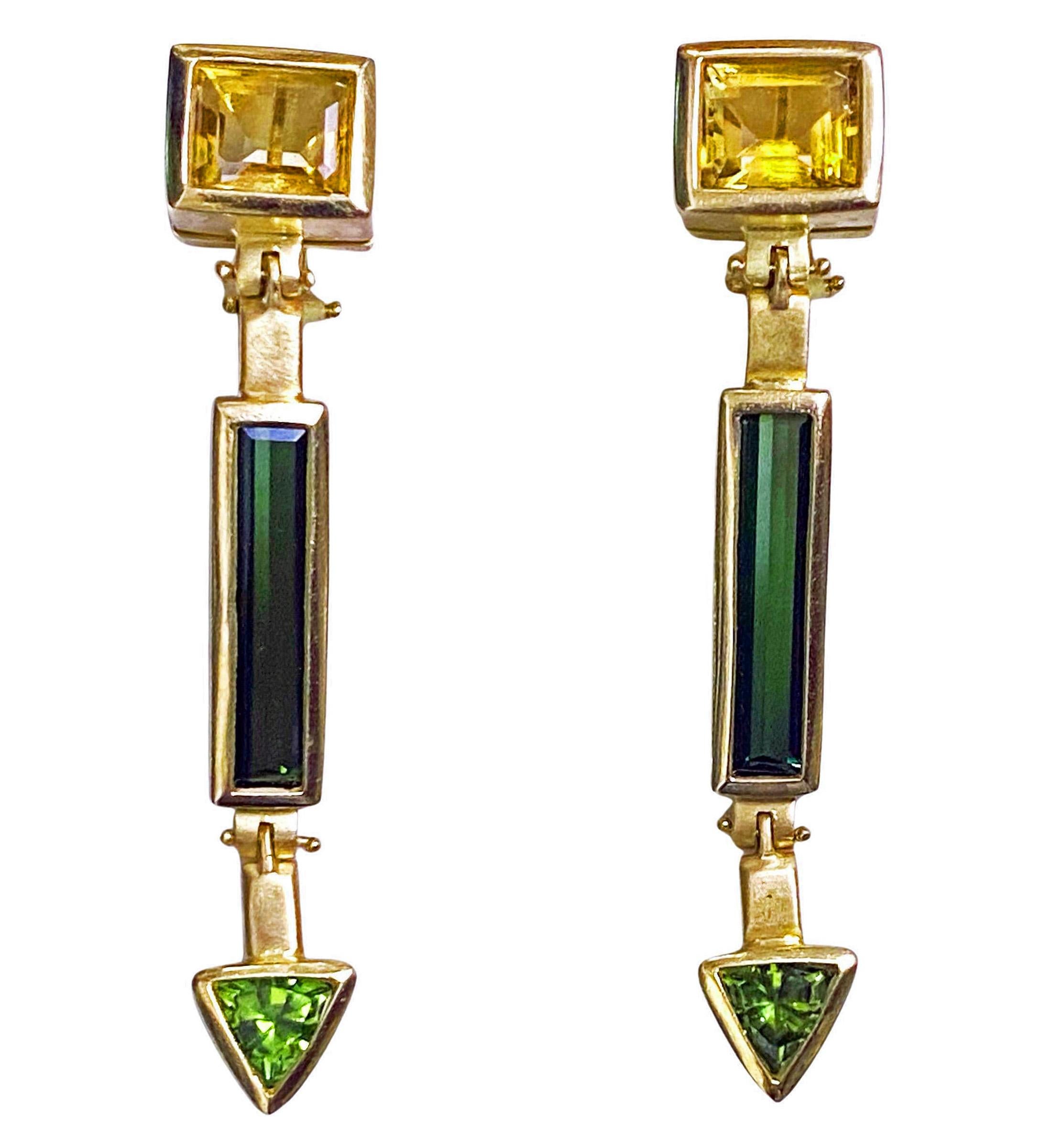 1980’s Tourmaline, Citrine, and Peridot 18K large drop Earrings. These custom-made Earrings of bold stunning design with three sections of square cut citrine, rectangular cut green tourmaline and triangular cut peridot respectively’ with alternate