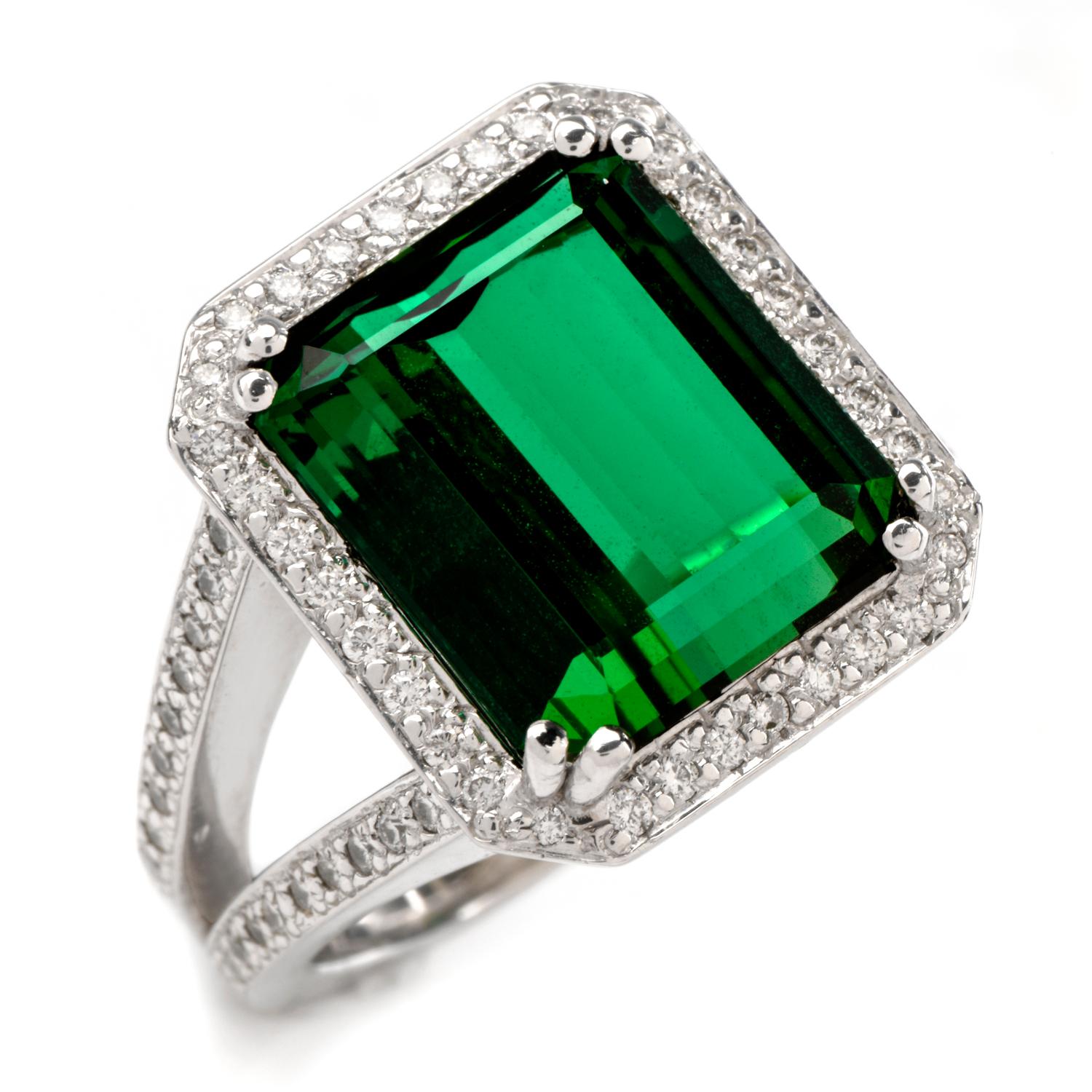 This bold tourmaline cocktail ring is crafted in solid 14-karat white gold, weighing 12.5 grams and measuring 17mm x 7mm high. Centered with one prominent emerald-cut green tourmaline, weighing approximately, 8.30 carats. Surrounded by a pave-set