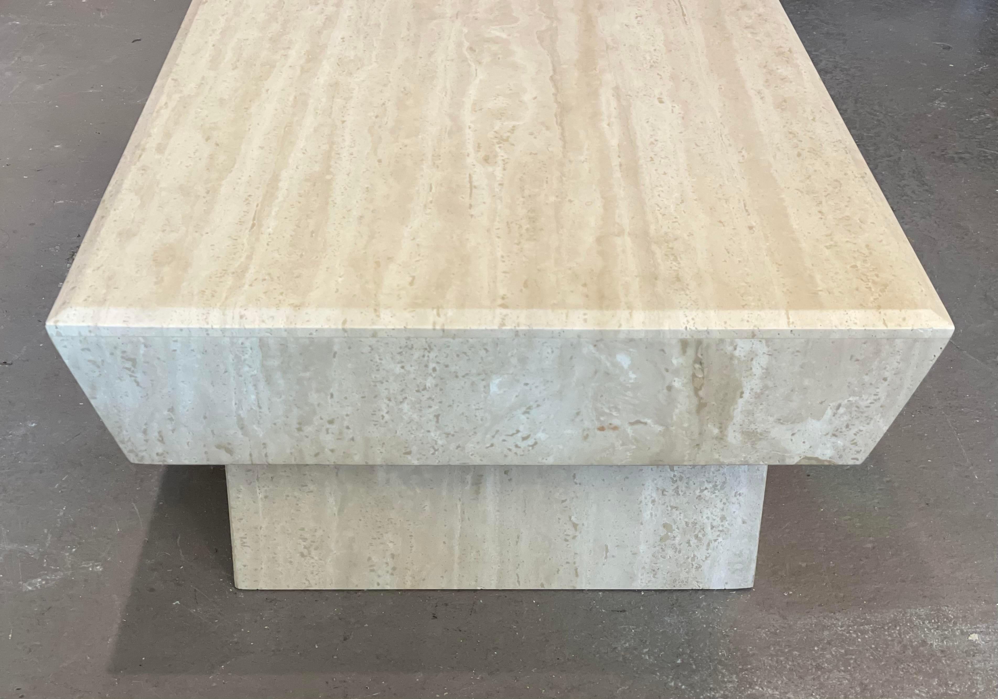 So so cool! I love the double bases and angles edges of this coffee table. The soft travertine contrasts with the shape lines. Excellent condition.