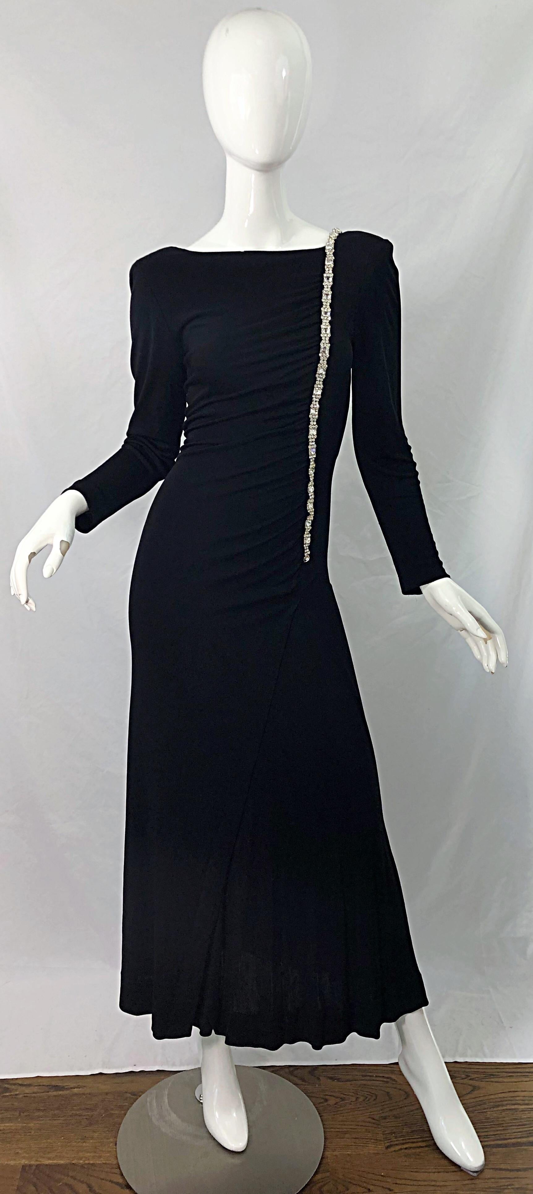 Beautiful and timeless WILLIAM TRAVILLA black matte silk jersey rhinestone encrusted long sleeve evening gown ! Features flattering ruching throughout the bodice. Interior shoulder pads add just the right amount of volume. Rhinestones hand-sewn