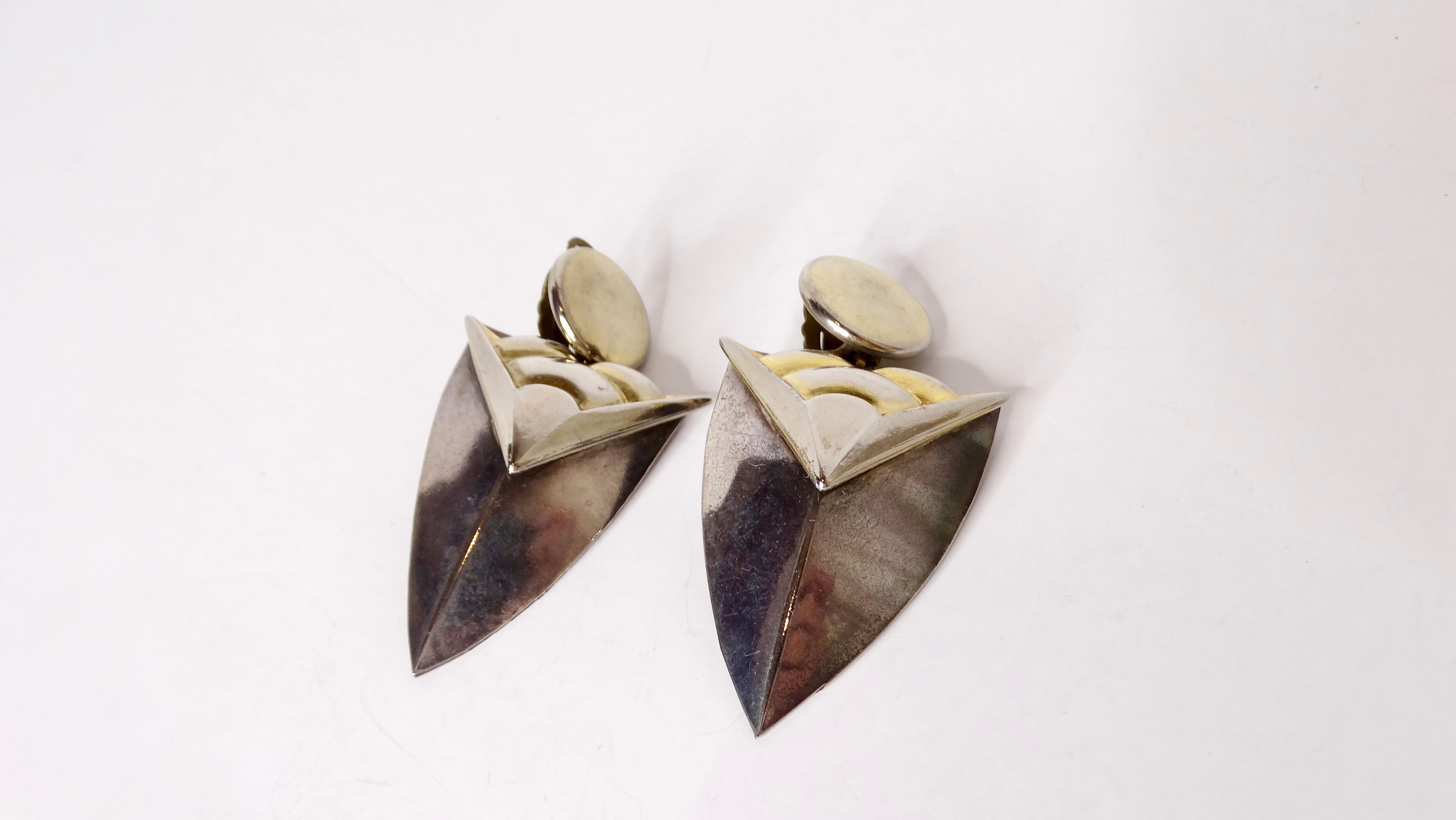 Step back into the vibrant era of the 1980s with these stunning Two-Tone Geometric Clip-On Earrings, exquisitely crafted from a mix of metal and brass and 14k gold plating. Their unique design, reminiscent of the head of a sphere, showcases bold