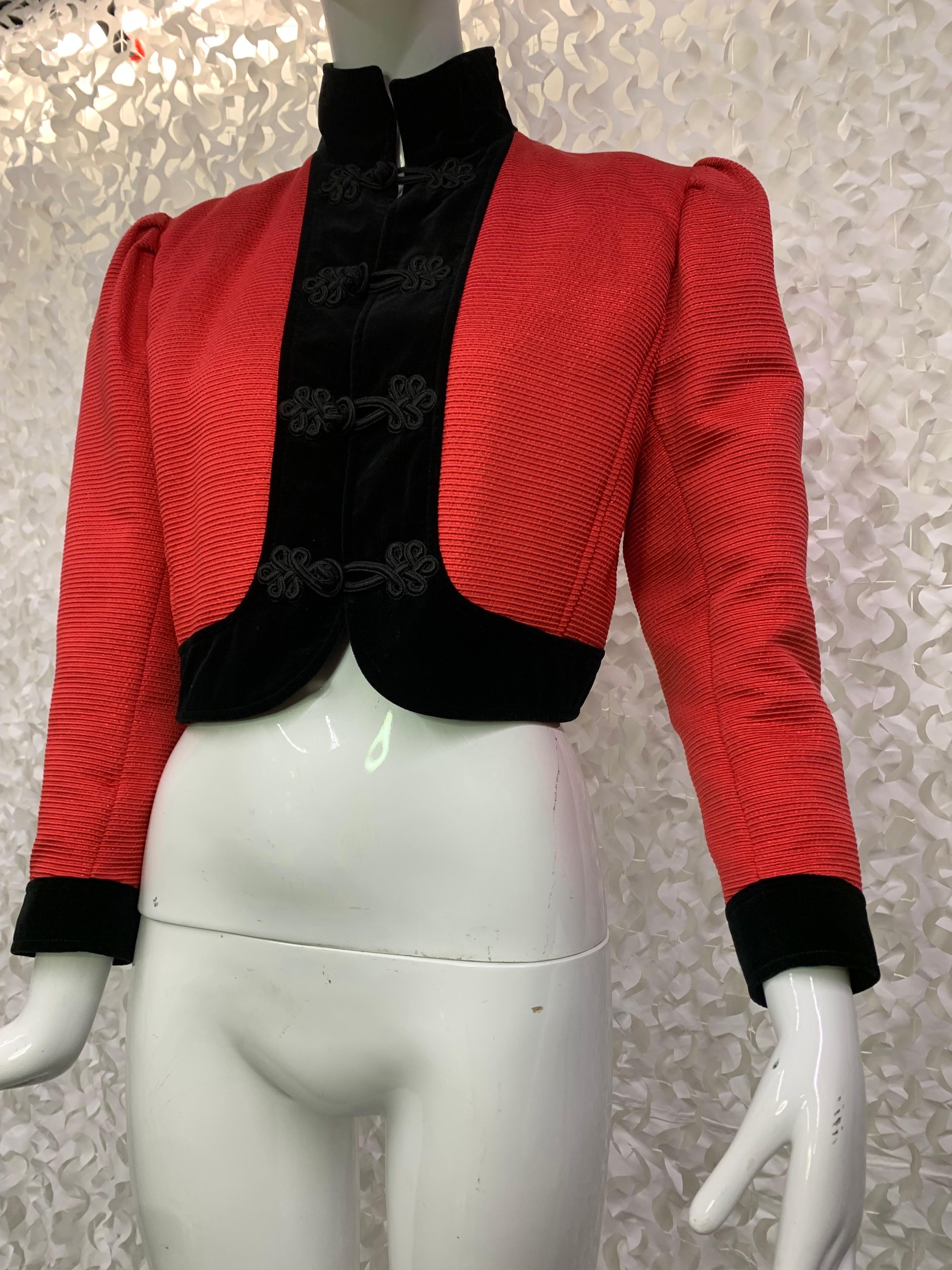 1980s Ungaro Red Silk Faille Bolero Jacket w Black Velvet Trim & High Collar:  Front frog closures and pleated puff shoulders. Tapered sleeves with  banded cuffs. Size US 4-6. 