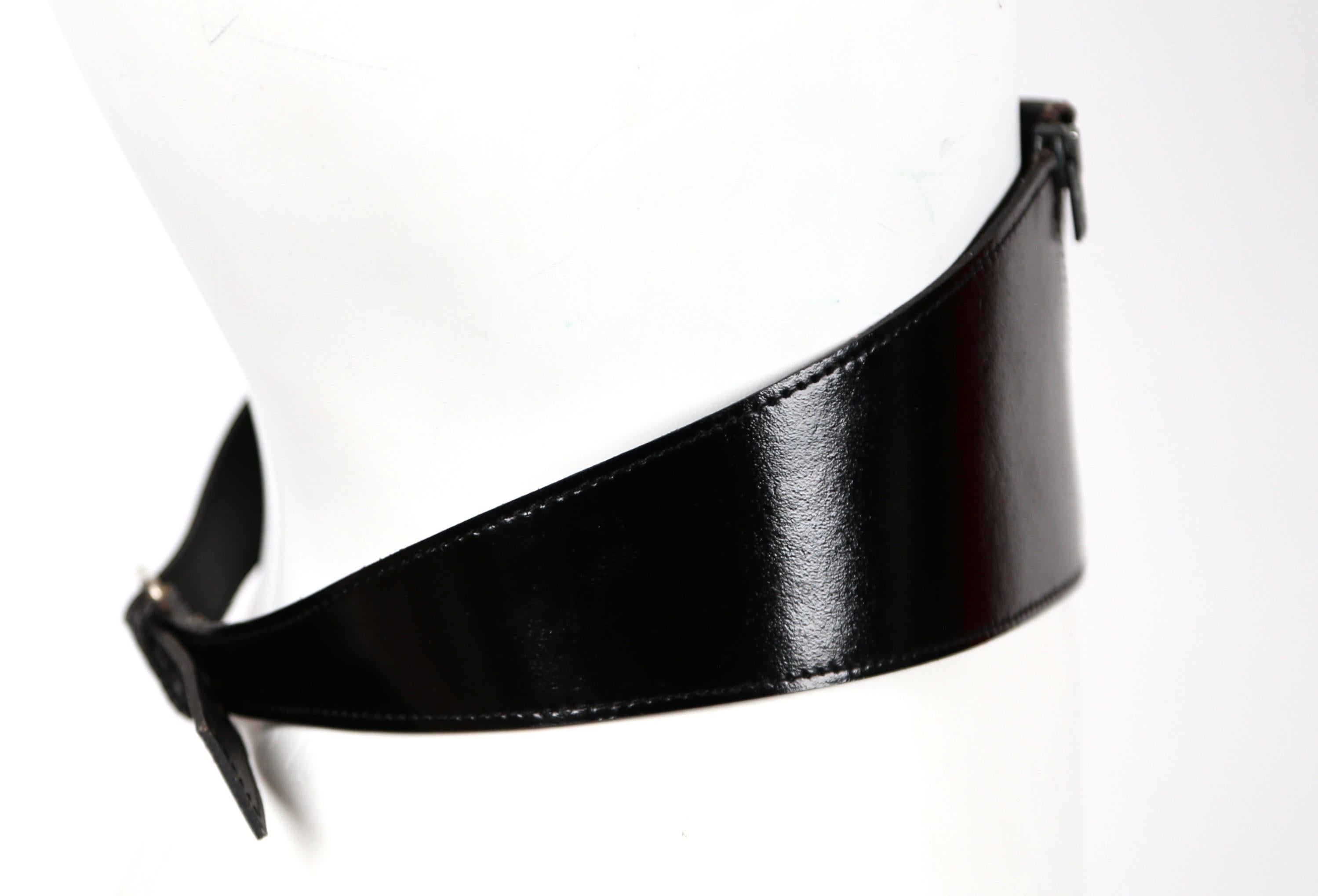Jet-black, patent leather belt with zipper detail designed by Azzedine Alaia for Vacher dating to the 1980's. French size 70, which best fits a 25-28.5