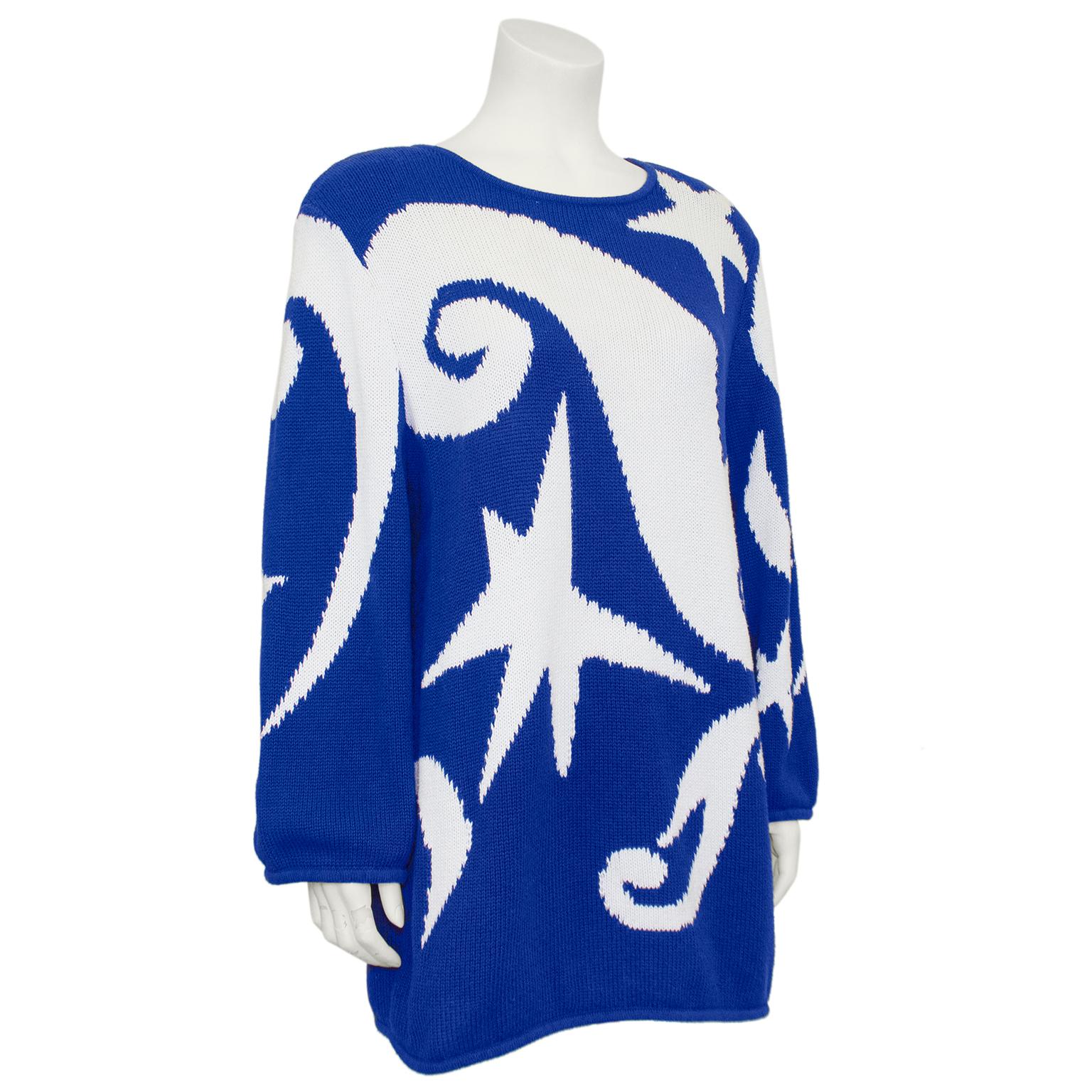 Fun 1980s Valentino graphic sweater inspired by Henri Matisse. Cobalt blue with various large contrasting white abstract stars and swirls. Cotton knit, so it is a great seasonally transitional piece. Slightly oversized and long, can fit more like a