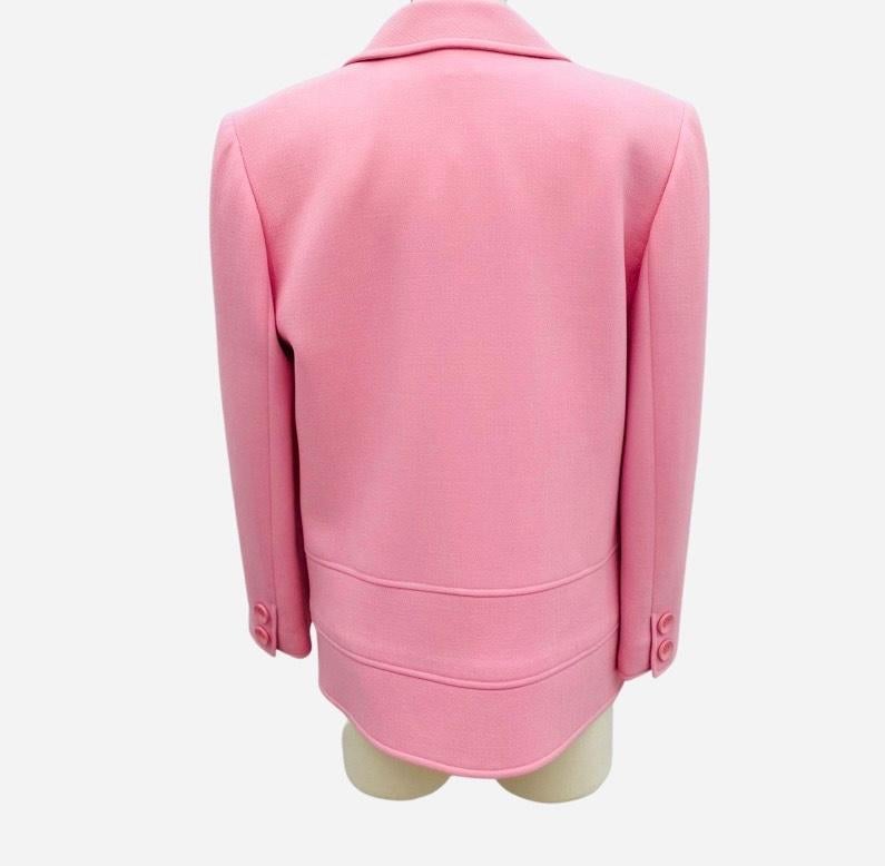 Beautiful 1980s Valentino mod style pea coat in a bubblegum pink light weave wool.  Double breasted with two button closure and original pink resin buttons. Straight down fit and falls hip length. Two minor marks but otherwise in in very good