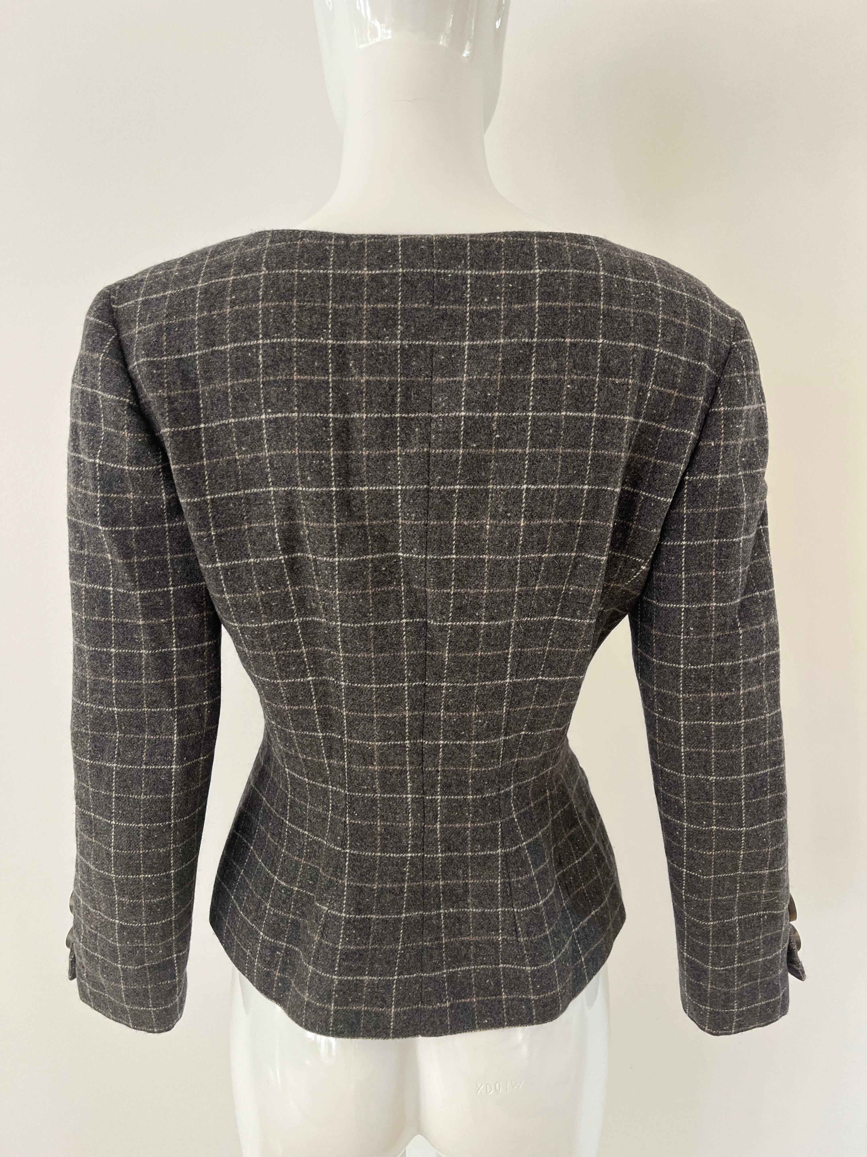1980s Valentino V Studio Jacket in a soft speckled grey wool with windowpane design in a woven white and tan. Swirled resign buttons and a fitted waist silhouette with contouring seams.  Two front slash pockets and fully lined in black silk. 