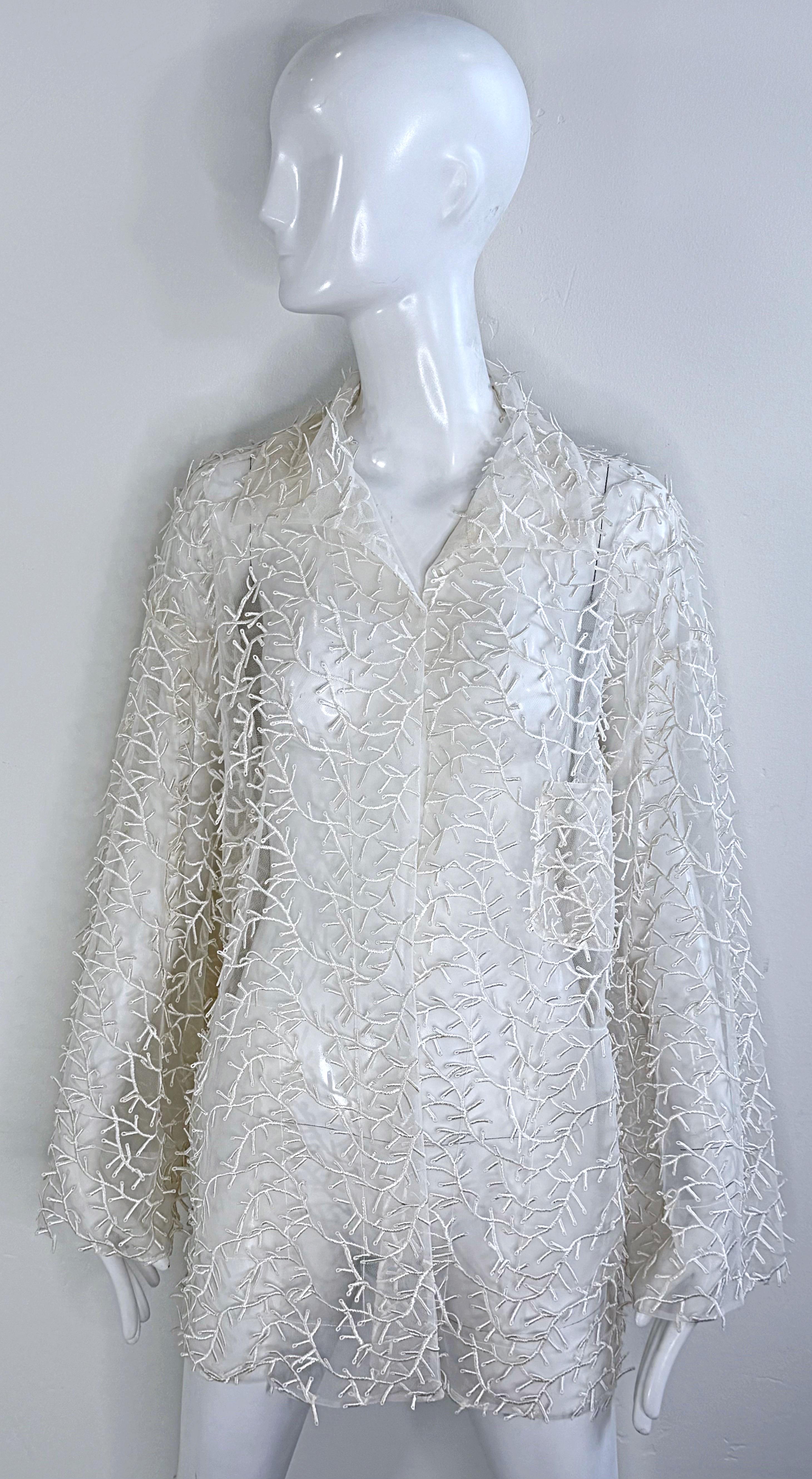 Amazing Valentino ‘Miss V’ 1980s white sheer nylon embroidered jacket or blouse !  The perfect layering piece, belted or alone.
In great unworn condition
Made in Italy
Approximately Size Medium / Large / Extra Large ( can be worn oversized