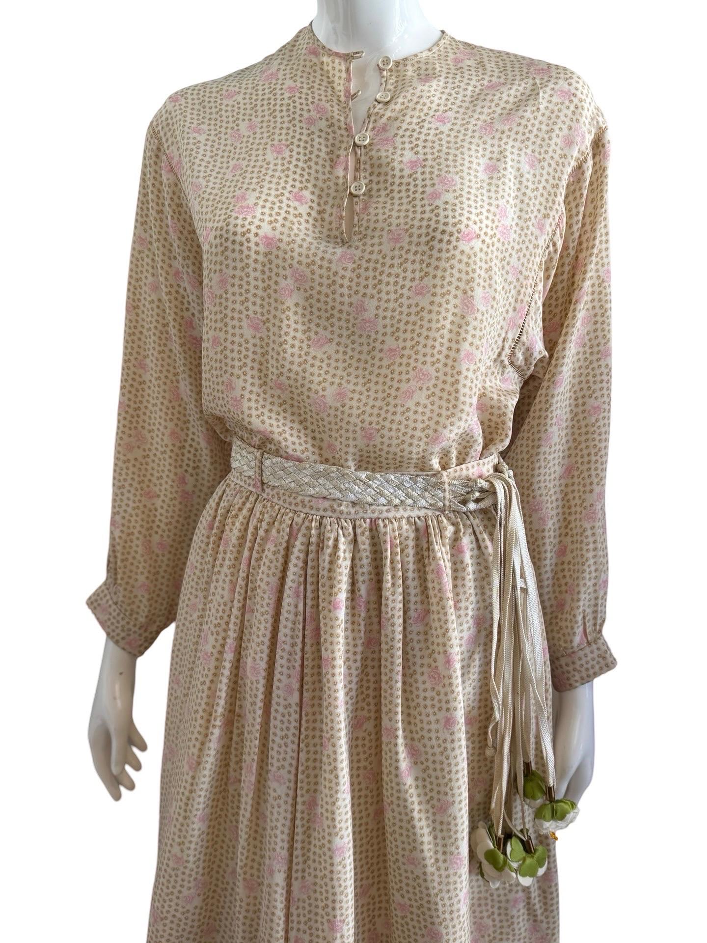 The most beautiful skirt and top set from 1980s Valentino Boutique collection.  This is a layered silk skirt with a woven belt of shoe string material that has white flowers at the end of the ropes.   The blouse has a soft sloping shoulder for an