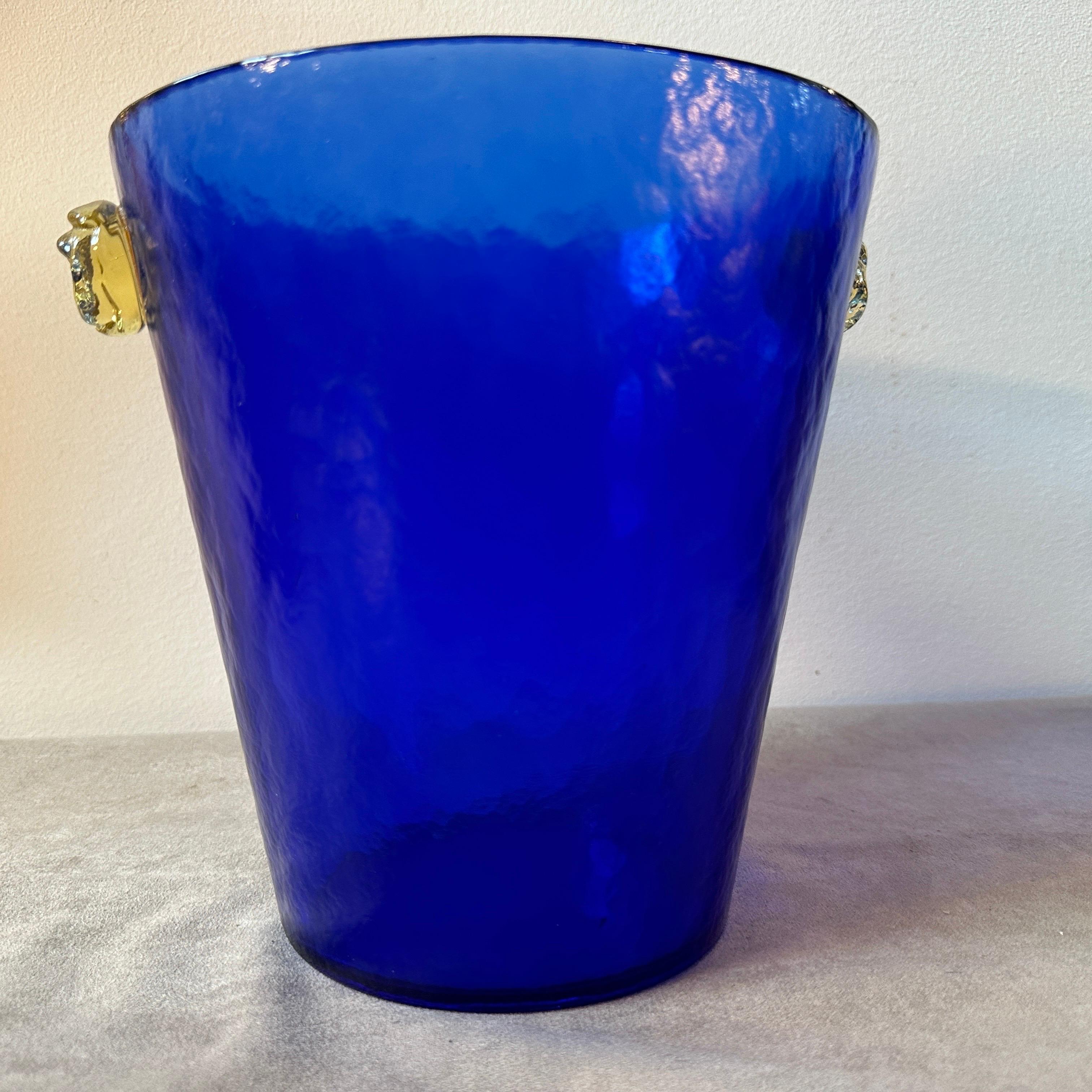 A modernist blue and yellow murano glass wine cooler designed and manufactured in Murano in the Eighties, it's labeled on a side and in perfect conditions. The Battuto technique of the wine cooler it has been used long time by Fulvio Bianconi per