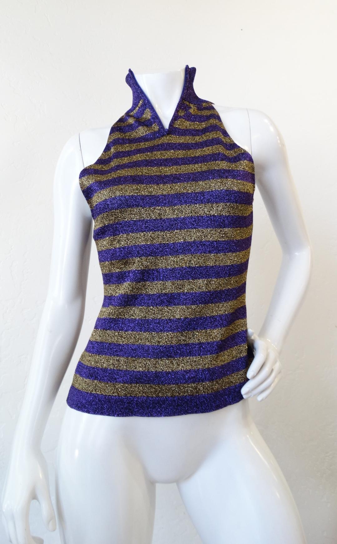 Incredible lurex knit top from iconic designer Gianni Versace circa 1980s! Shimmering lurex knit in purple and gold horizontal striped pattern. Sleeveless turtleneck style silhouette with hidden zipper up the back of the neck. Made in Italy. Easily
