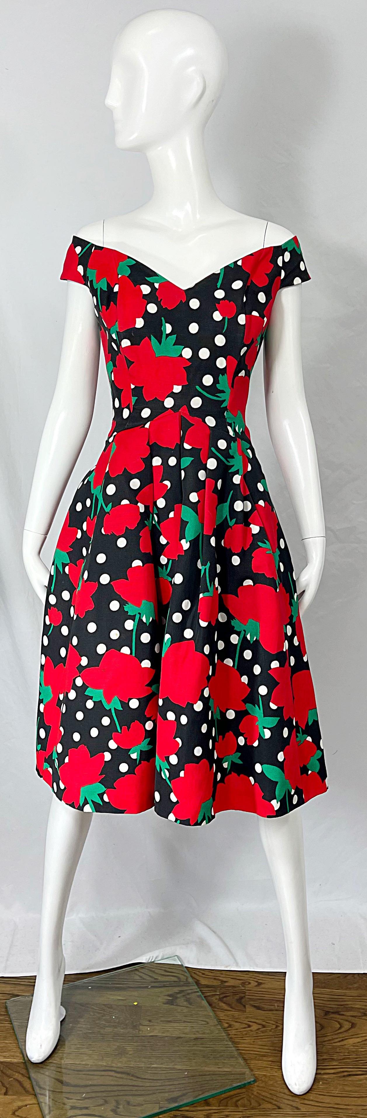 Beautiful vintage 80s VICTOR COSTA red, black and white rose and polka dot print off the shoulder fit n’ flare cotton dress ! Tailored boned bodice that sits off the shoulder with a sweetheart neckline. Roses and polka dots printed throughout. Full