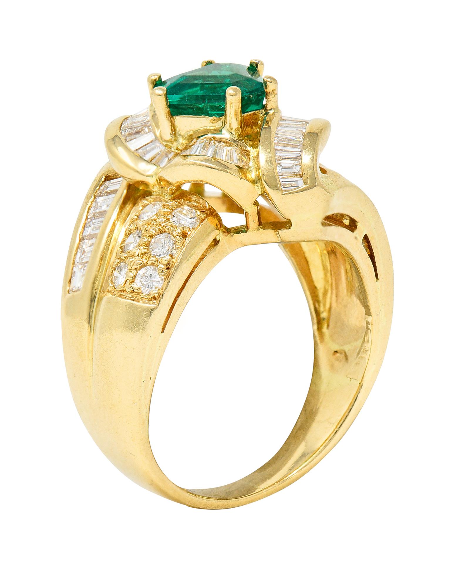 Bypass style ring is designed as a knot motif with a ribbon-like channel wrapping throughout

Featuring a hexagonal cut Colombian emerald weighing approximately 0.84 carat

Vividly green in color and semi-transparent with natural inclusions - minor
