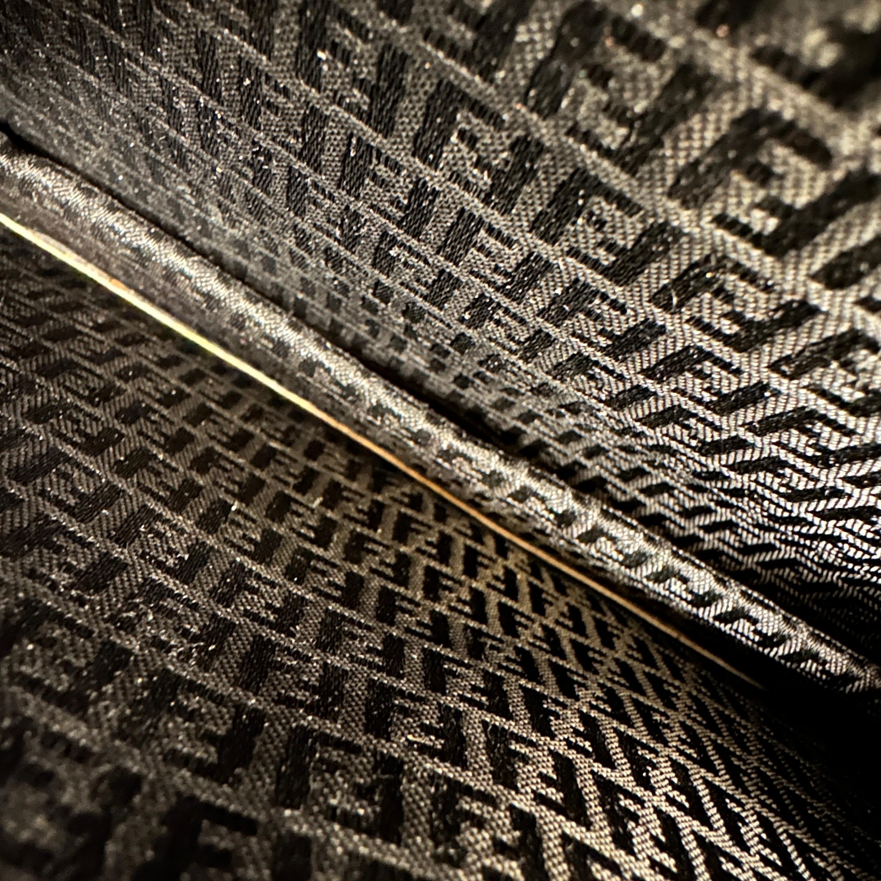 This vintage Fendi clutch bag features the iconic 