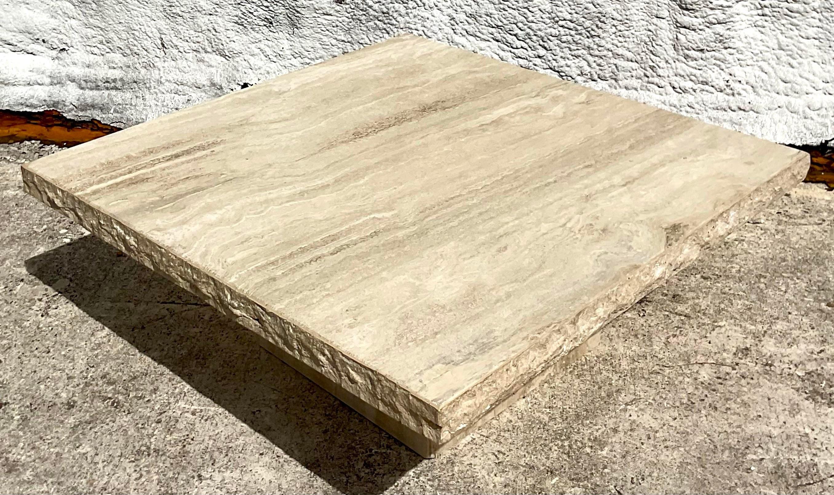 Channeling the free-spirited allure of Bohemian style, this vintage travertine coffee table offers a chic centerpiece for your living space. With its timeless appeal and American craftsmanship, it effortlessly blends earthy elegance with modern