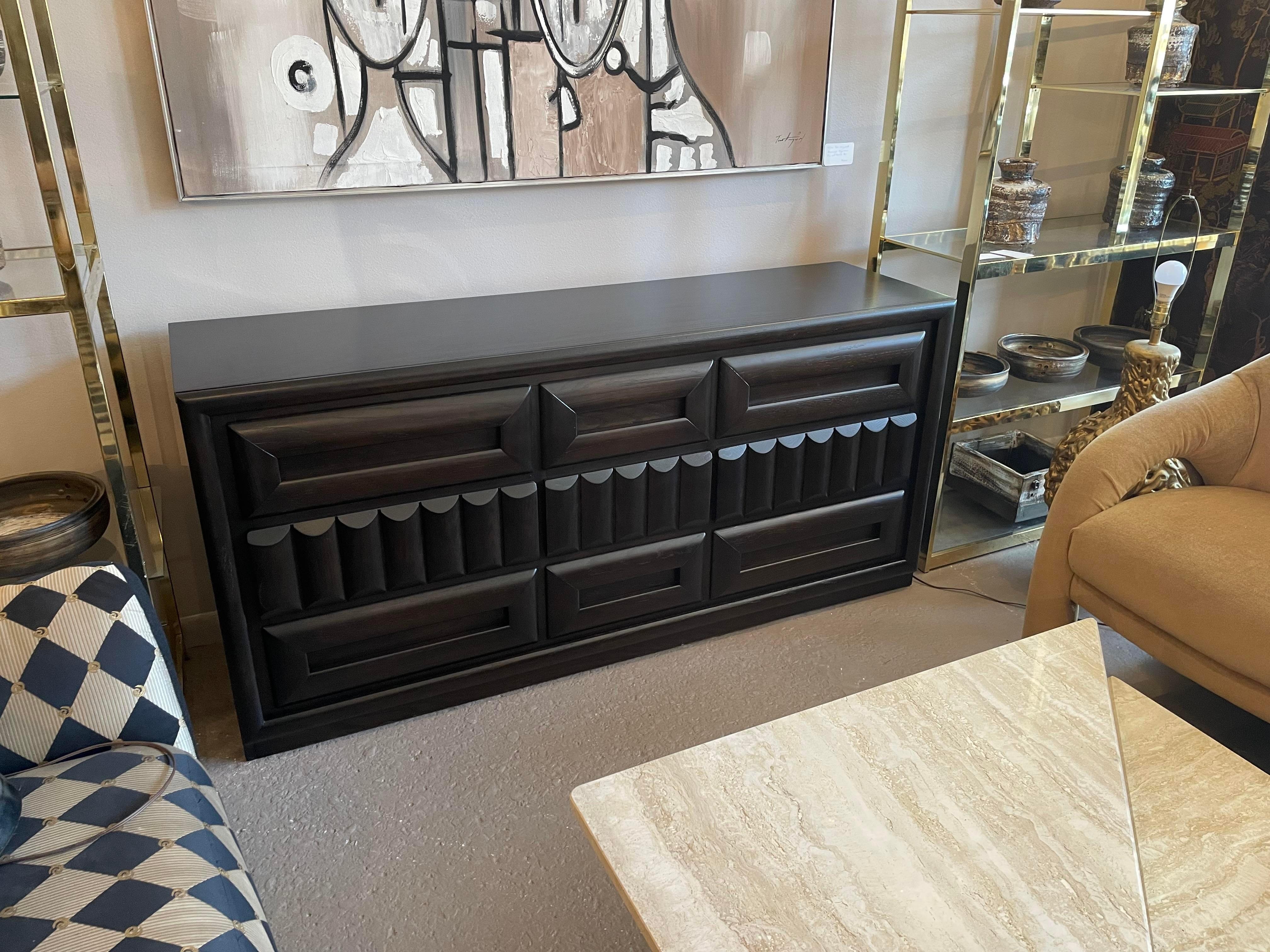 Absolutely love this. We refinished this piece to a very dark brown/almost black stain. All of the drawers open easily.
 