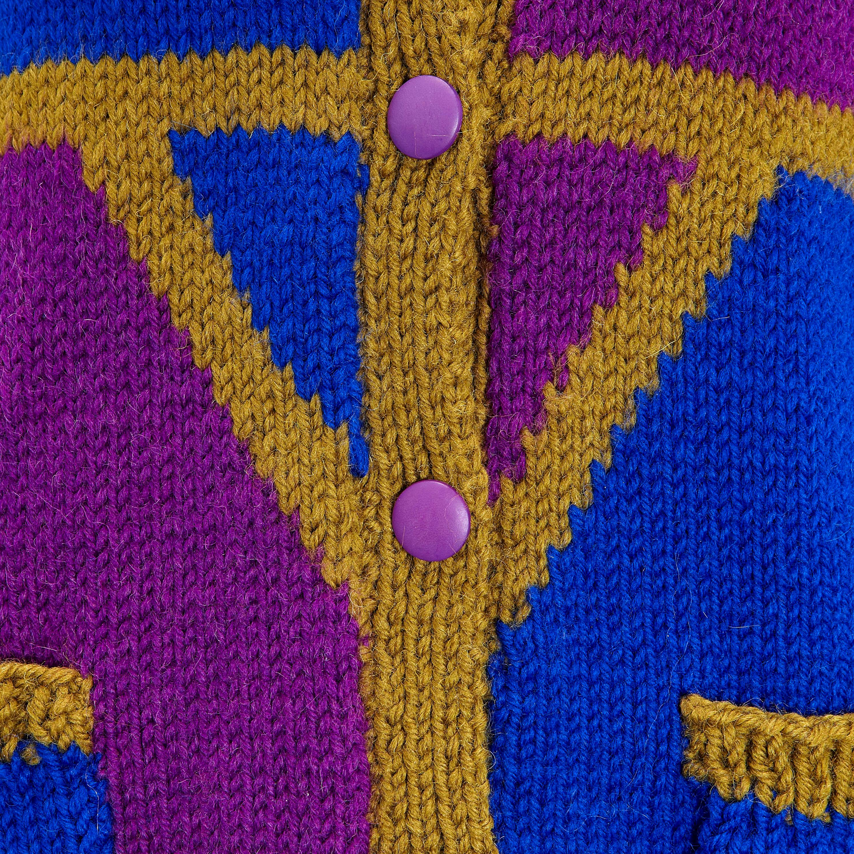 Product details: 1980s Vintage Cardigan Khaki Blue & Purple Hand Knit - Ribbed Knit Hem, Collar & Cuff Detail
Label: Unknown 
Fabric Content: Hand Knitted Wool
Size: UK 12
Bust: 42