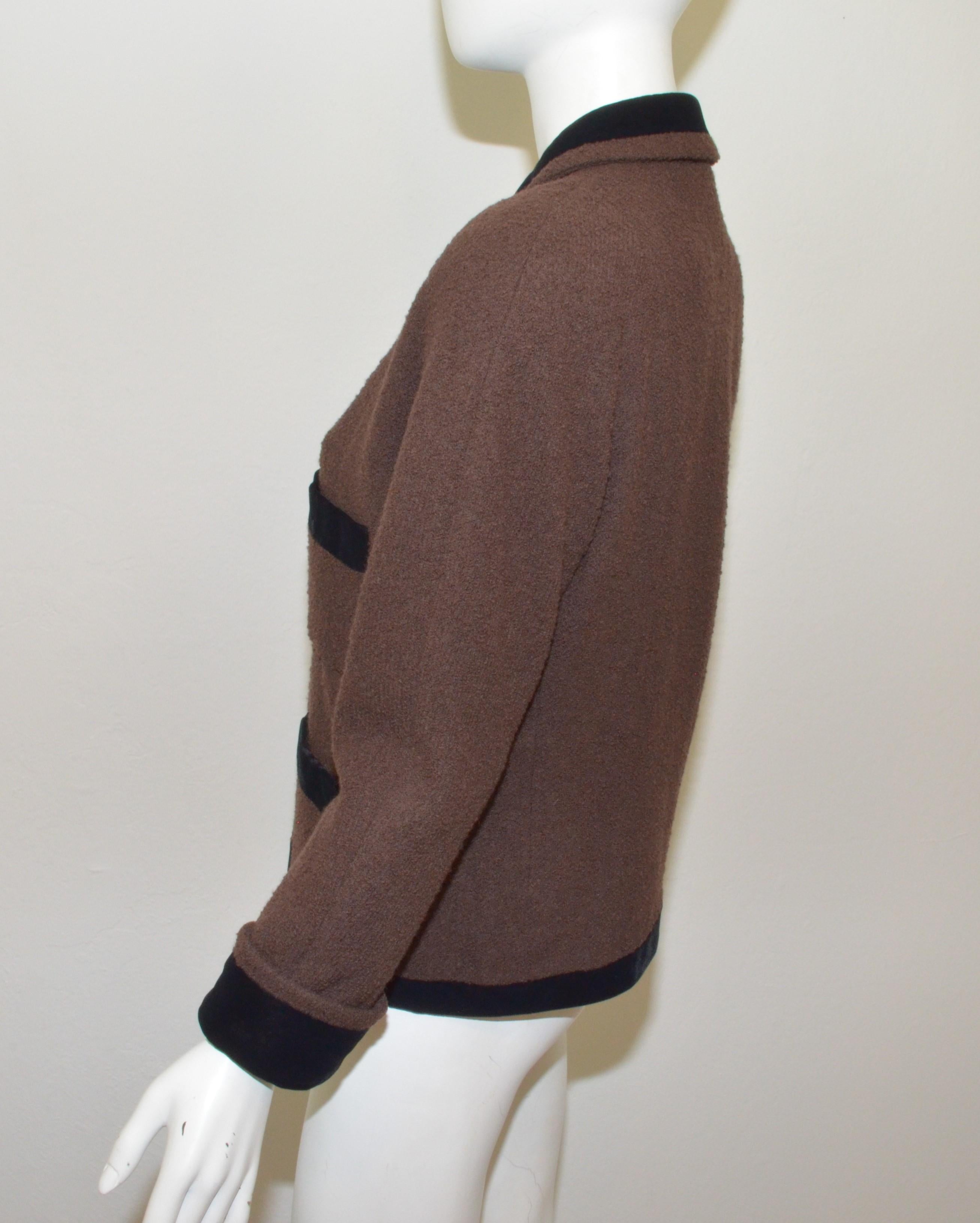 1980’s Chanel Brown Tweed Jacket with Velvet Trim -- jacket is featured in a brown tweed knit with black velvet trimming and an open front with a clover & chain latch closure at the collar. Jacket is fully lined in silk with a chain trim along the