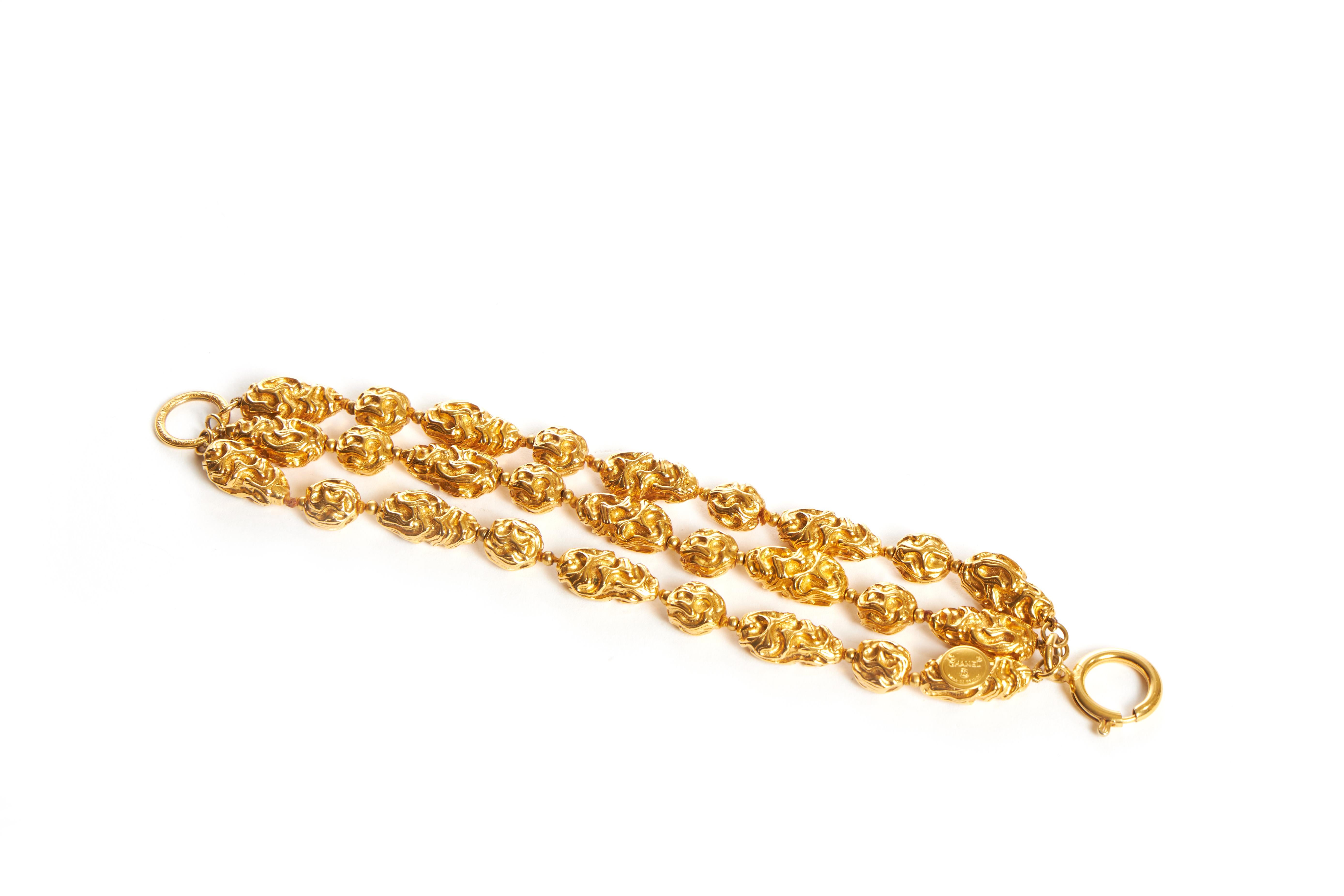 Chanel triple strand gold tone nuggets bracelet. 80s collection. Comes with original duster or box.