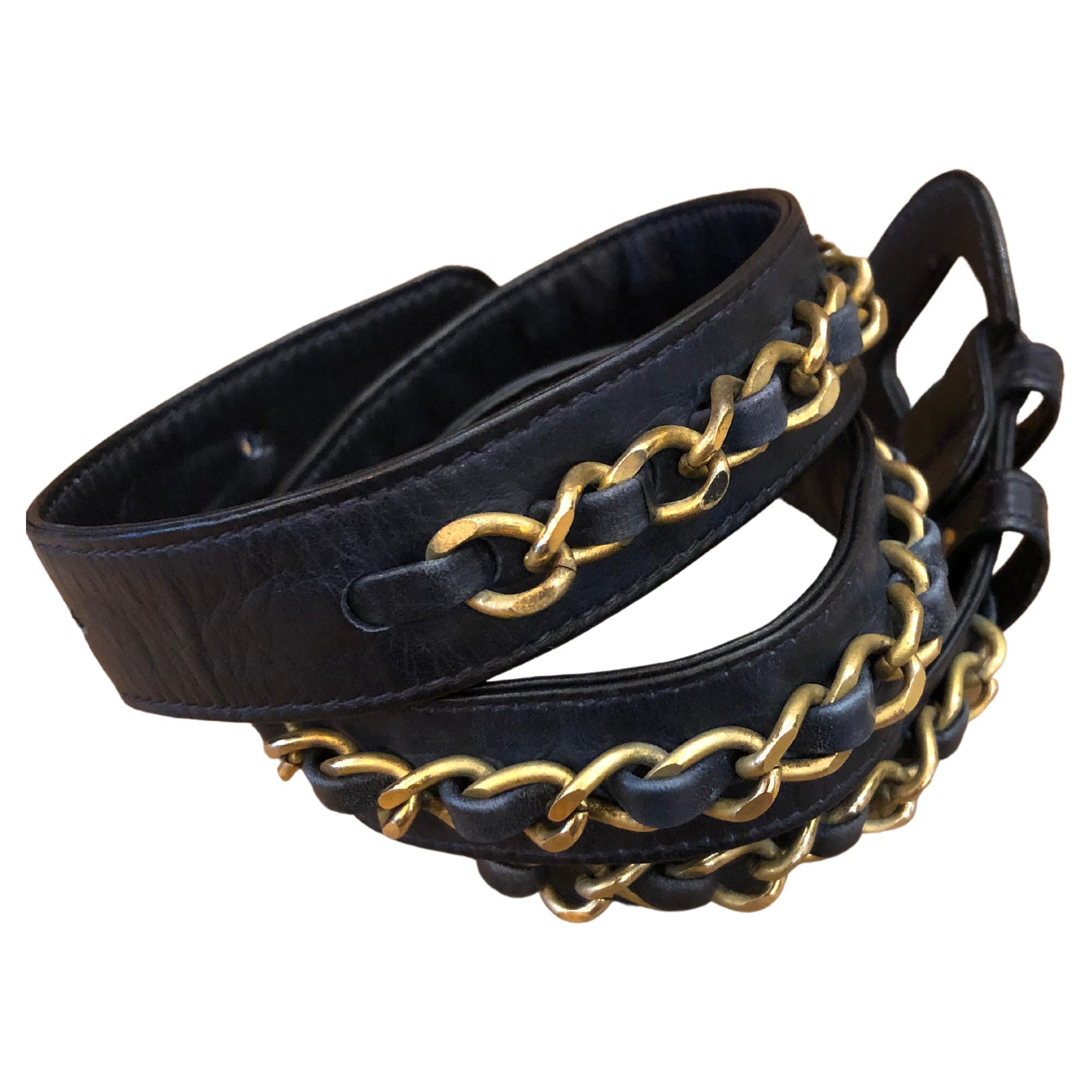 This vintage Chanel belt is crafted of lambskin leather in navy and gold tone chain interlaced with the same leather. It once belonged to a vintage Chanel belt bag. Stamped CHANEL made in France. Adjustable buckle fastening with three holes. Size
