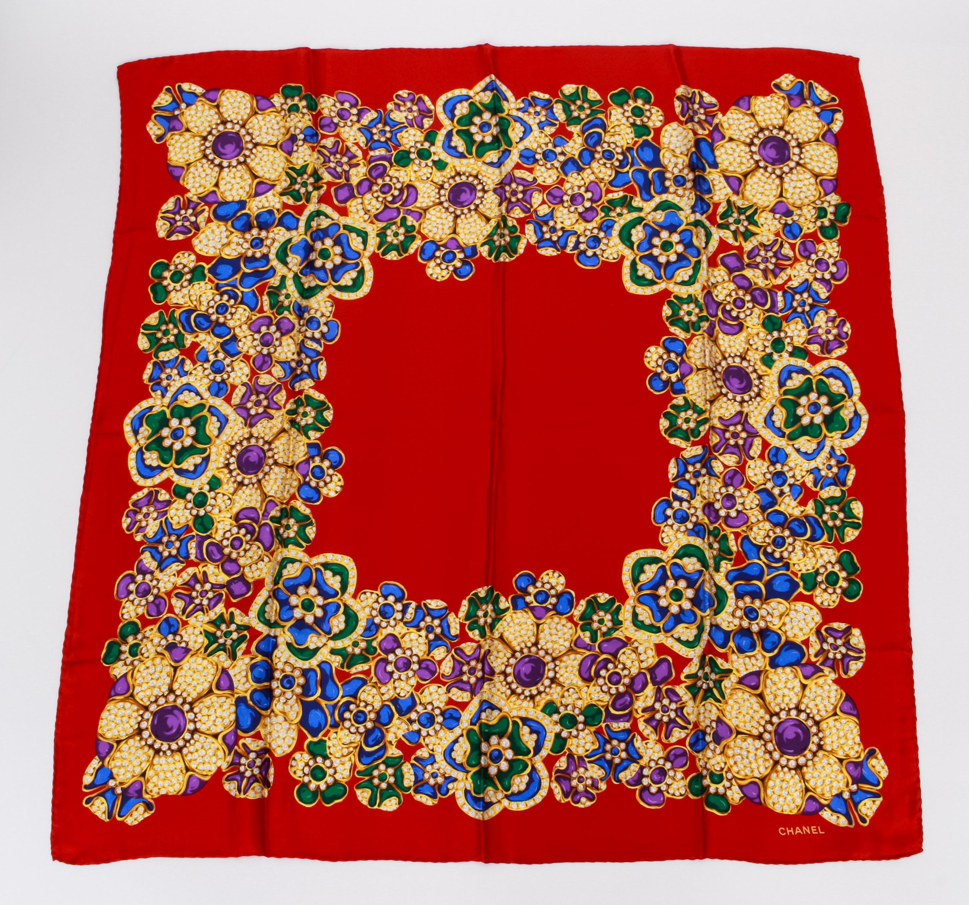 Chanel rare and collectible bright red gripoix silk scarf, original care tag still attached. Excellent condition. Hand rolled edges.
