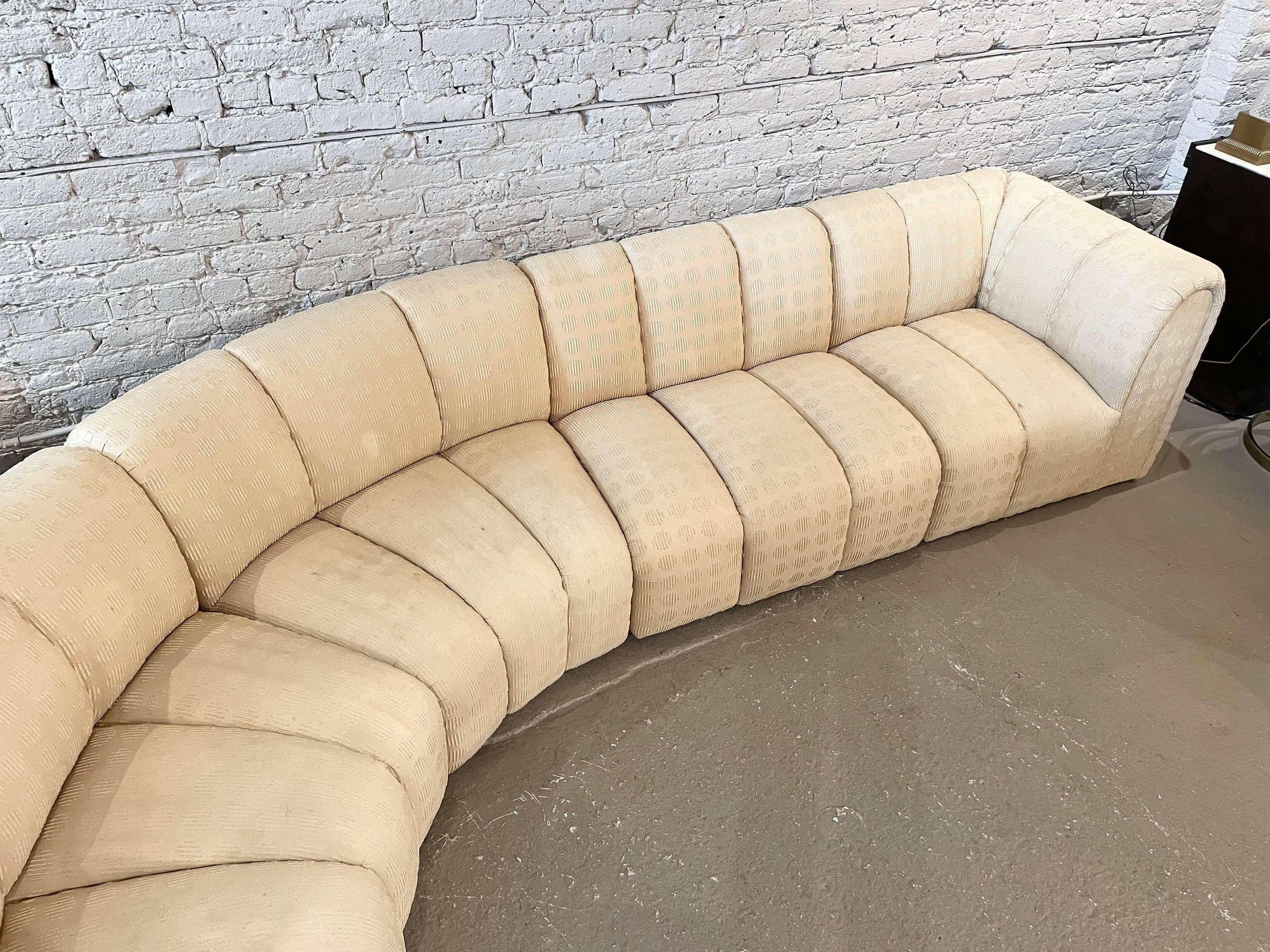 Stunning channeled sofa that is so comfy. You really just fall into this. It comes in 4 pieces. Upholstery suggested. But the cushions and foam are great!