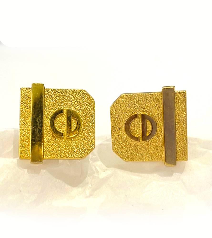 1980s Christian Dior Cufflinks in an Art Deco style, gold tone metal, hammered effect behind the Christian Dior Logo, Made in Germany

Dimensions: 3cm 
