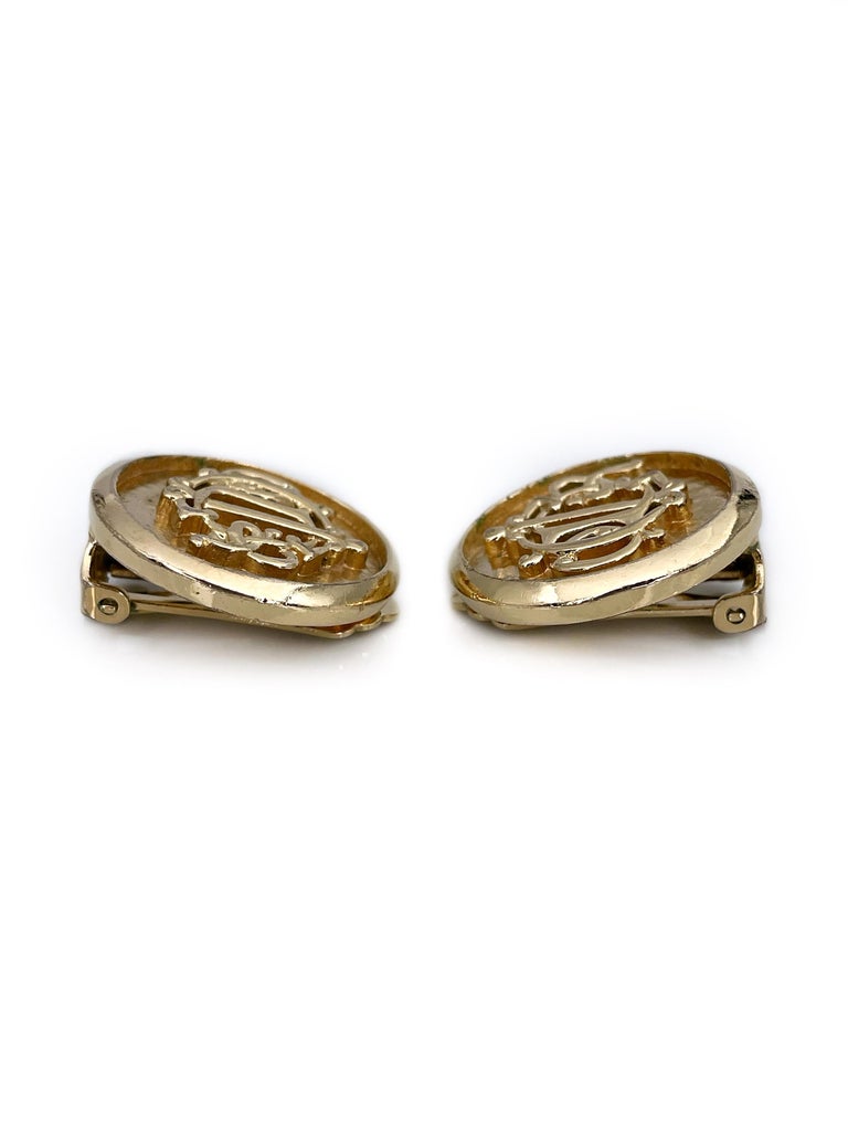 Modern 1980s Vintage Christian Dior Gold Tone Monogram Round Clip on Earrings For Sale