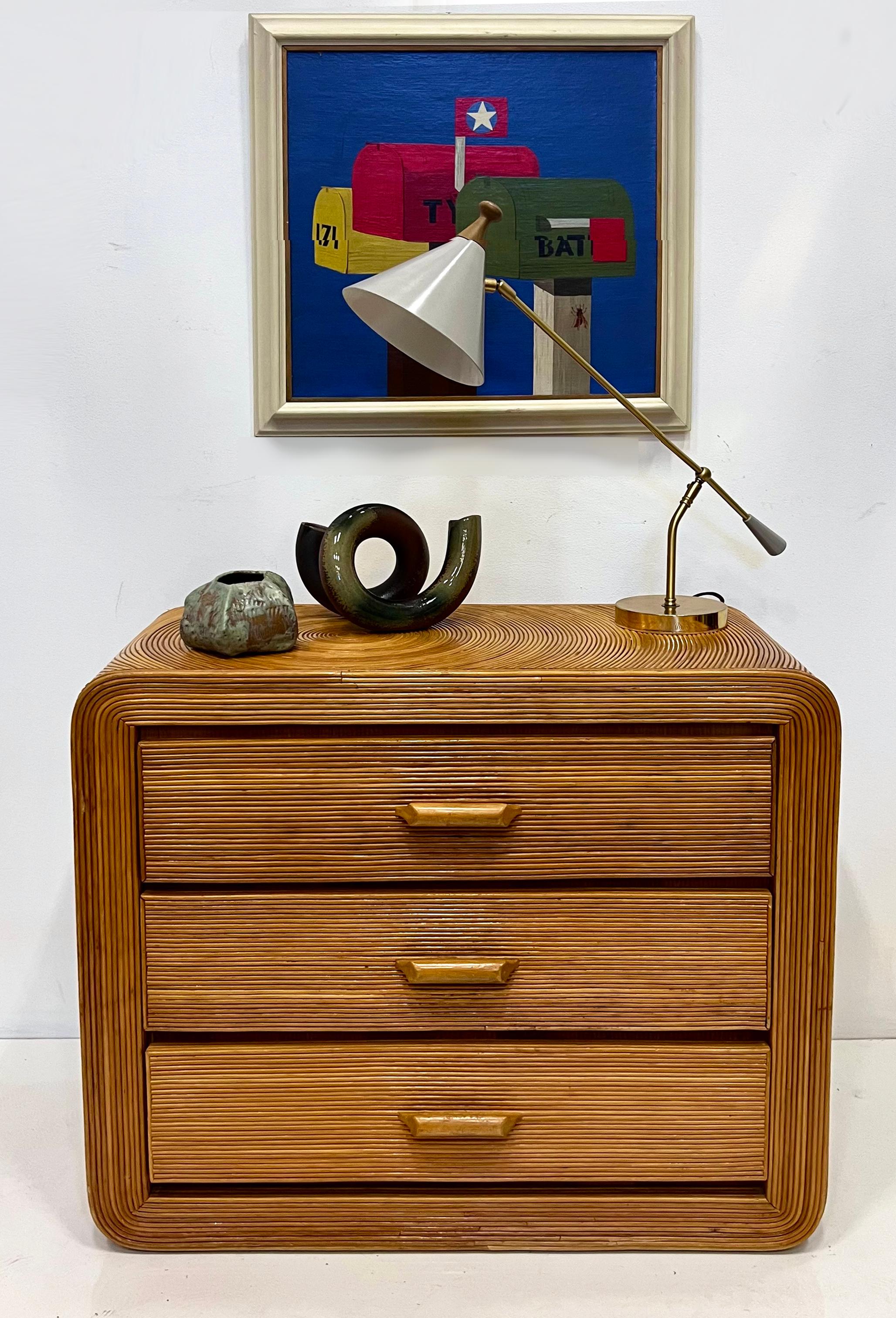 



Vintage Coastal Pencil Reed Chest of Drawers, Gabriela Crespi Manner

Offered for sale is a vintage Coastal pencil reed chest of drawers created after Gabriela Crespi.  There are 3 evenly sized drawers providing ample storage. The top of the