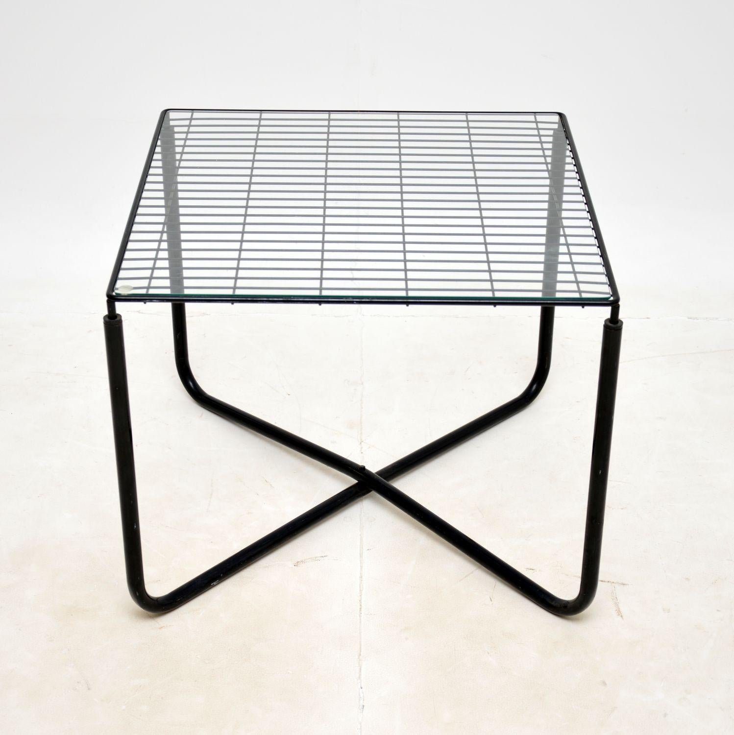 A stylish and iconic design, this is a 1980’s Vintage Jarpen coffee table by Niels Gammelgaard for Ikea.

The quality is excellent, this has a beautiful ebonised steel frame with an inset removable clear glass top.

The condition is excellent for