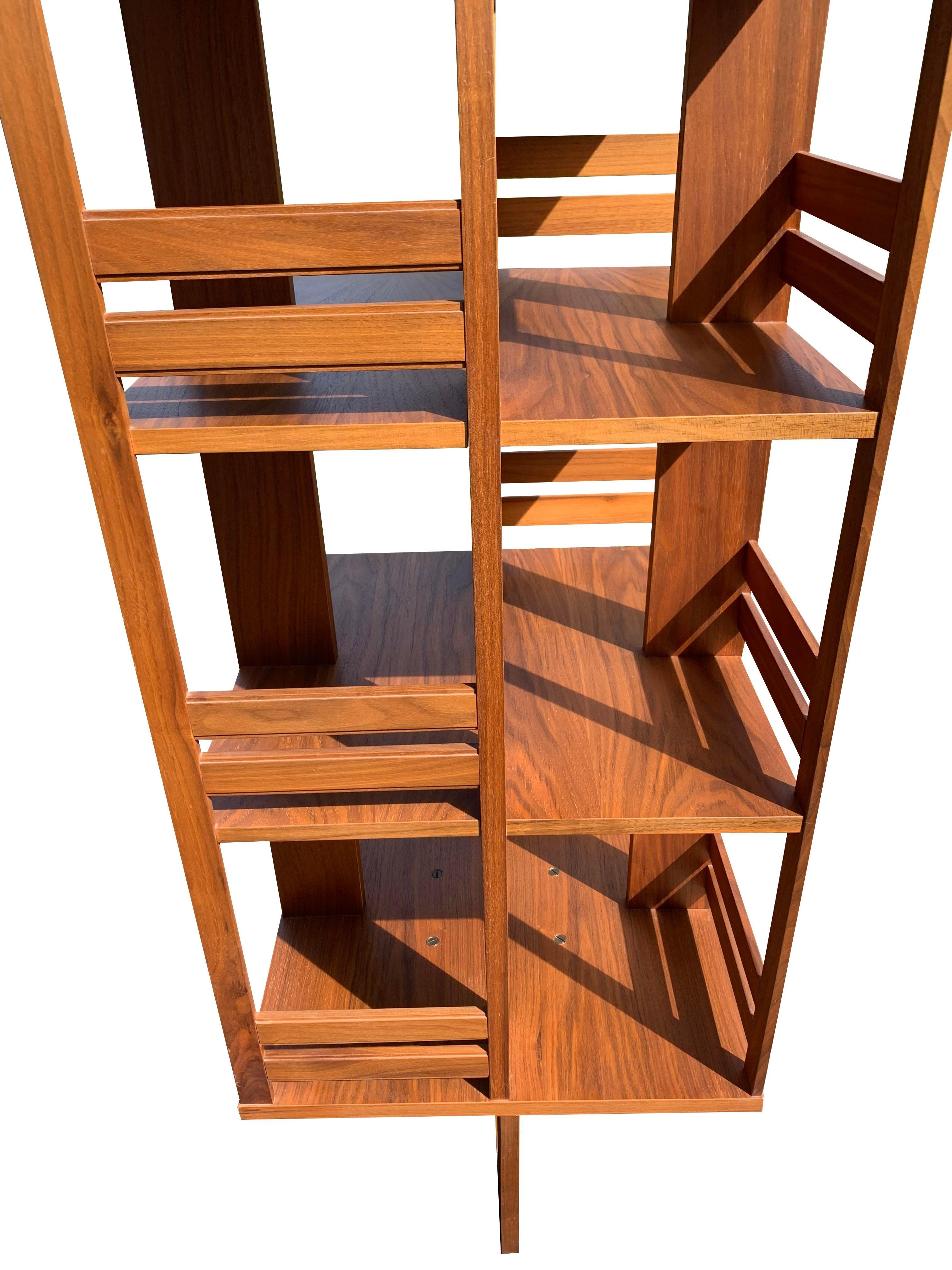 Vintage Danish Style Teak Rotating Bookcase

This vintage bookcase is a must-have for anyone looking to add a touch of retro style and functionality to their home. The unique design and high-quality materials make it a valuable and stylish piece